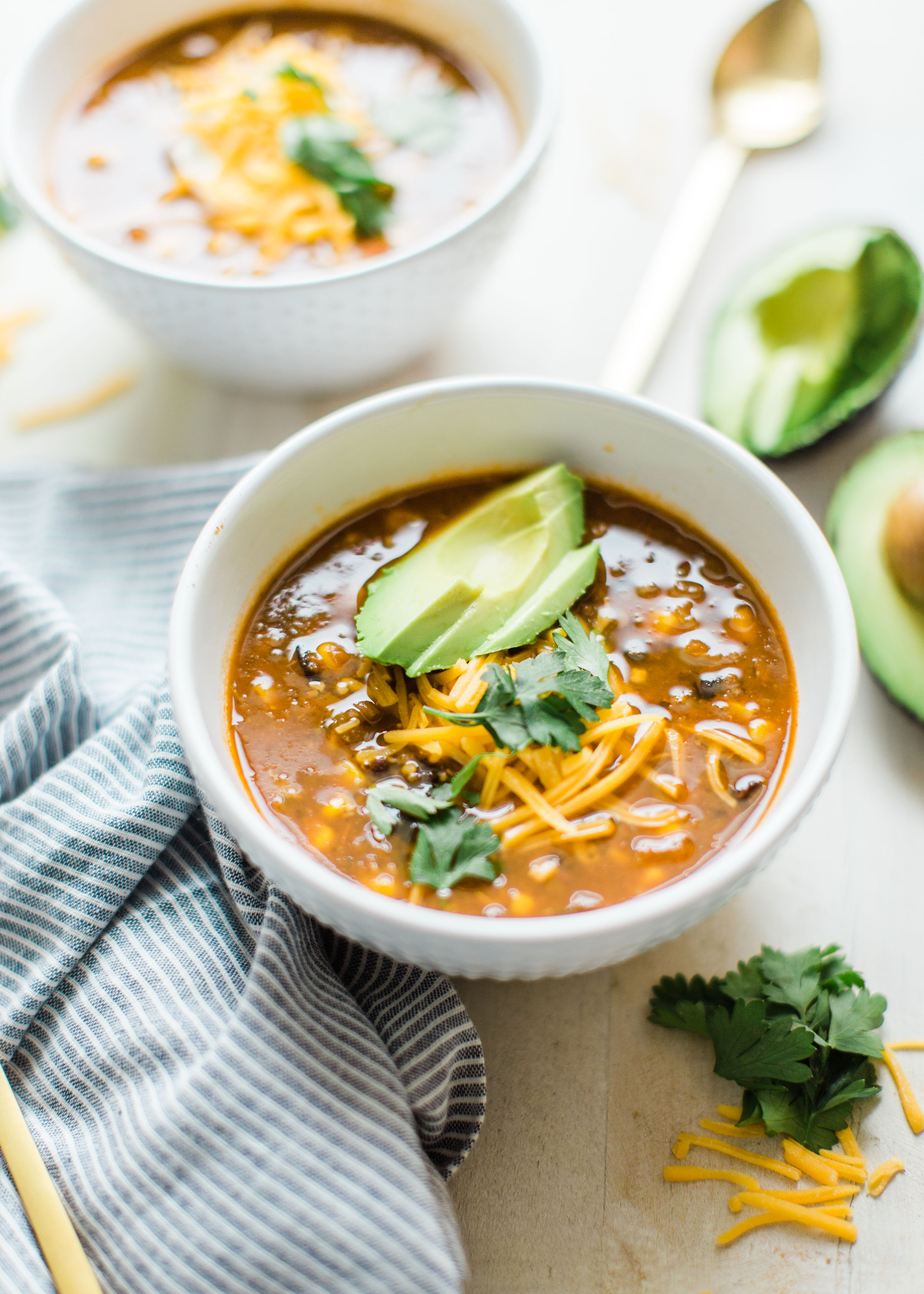 Obsessed with Trader Joe's Harvest Chili? Looking to whip up a delicious family dinner on a budget? Make your own easy copycat crockpot Trader Joe's harvest chili. (Say that three times fast!) This soup is vegetarian and so yummy. Click through for the recipe. #harvestchili #traderjoes #vegetarianchili #soup #vegetariansoup #crockpotchili #crockpotsoup #instantpot #crockpot #instantpotchili | glitterinc.com | @glitterinc