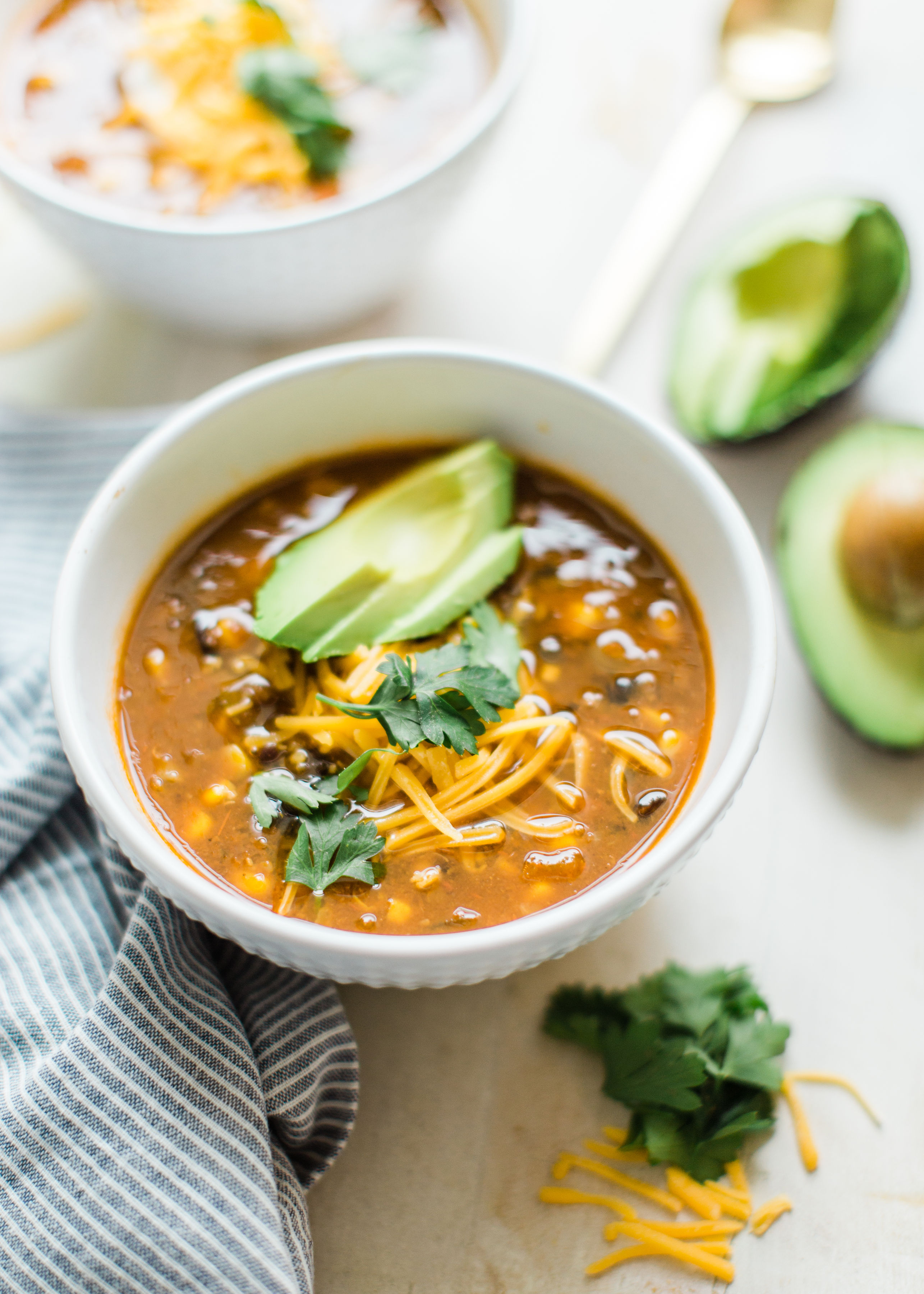 Obsessed with Trader Joe's Harvest Chili? Looking to whip up a delicious family dinner on a budget? Make your own easy copycat crockpot Trader Joe's harvest chili. (Say that three times fast!) This soup is vegetarian and so yummy. Click through for the recipe. #harvestchili #traderjoes #vegetarianchili #soup #vegetariansoup #crockpotchili #crockpotsoup #instantpot #crockpot #instantpotchili | glitterinc.com | @glitterinc