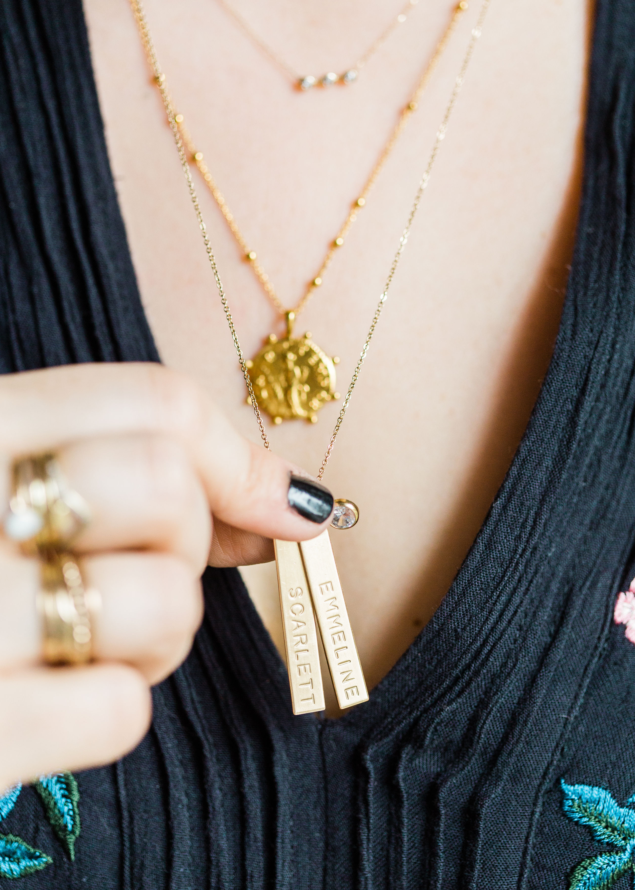 Searching for the perfect special gift for family and friends? Why not personalize it! Adding a monogram, initial, or personalized name, date, or special saying can make a gift feel 1,000% times more memorable. We're sharing all of the best personalized gifts this holiday season! (Including this gold vertical personalized nameplate bar necklace with my baby girls names on it.) #personalizedgift #personalizednecklace #nameplatenecklace #momnecklace #m