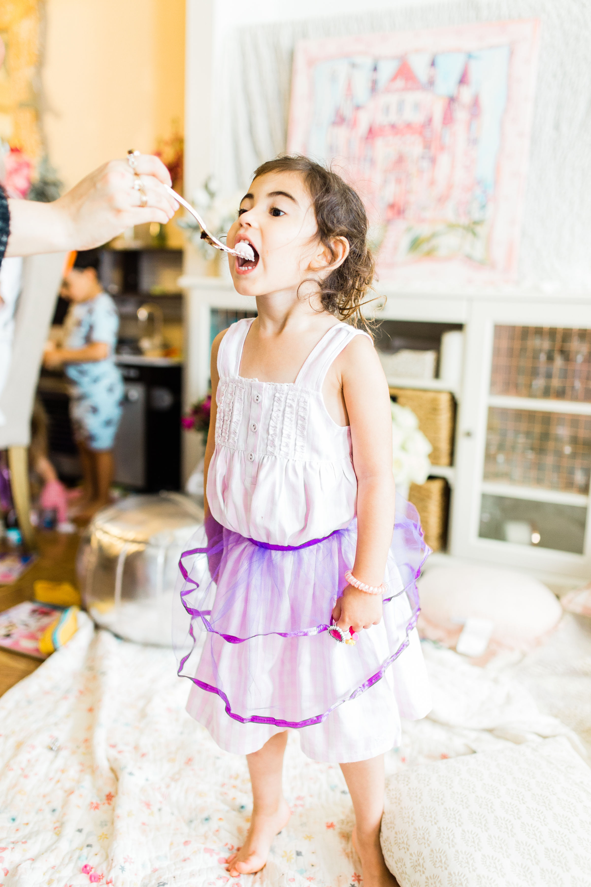 Ready to throw one beautiful and memorable princess pajama birthday party? Have we got some inspiration for you! We turned our living room into one giant slumber party and covered every available space with sheets, pillows, and blankets, plus gorgeous pink florals, a cozy tent lounge, a DIY magic mirror decorating activity for the kids, a dress-up station with crowns, wands, and wings, a pin the tail on the unicorn game, and so much more. Click through for the party details. #party #pajamaparty #princessparty #dressup | glitterinc.com | @glitterinc