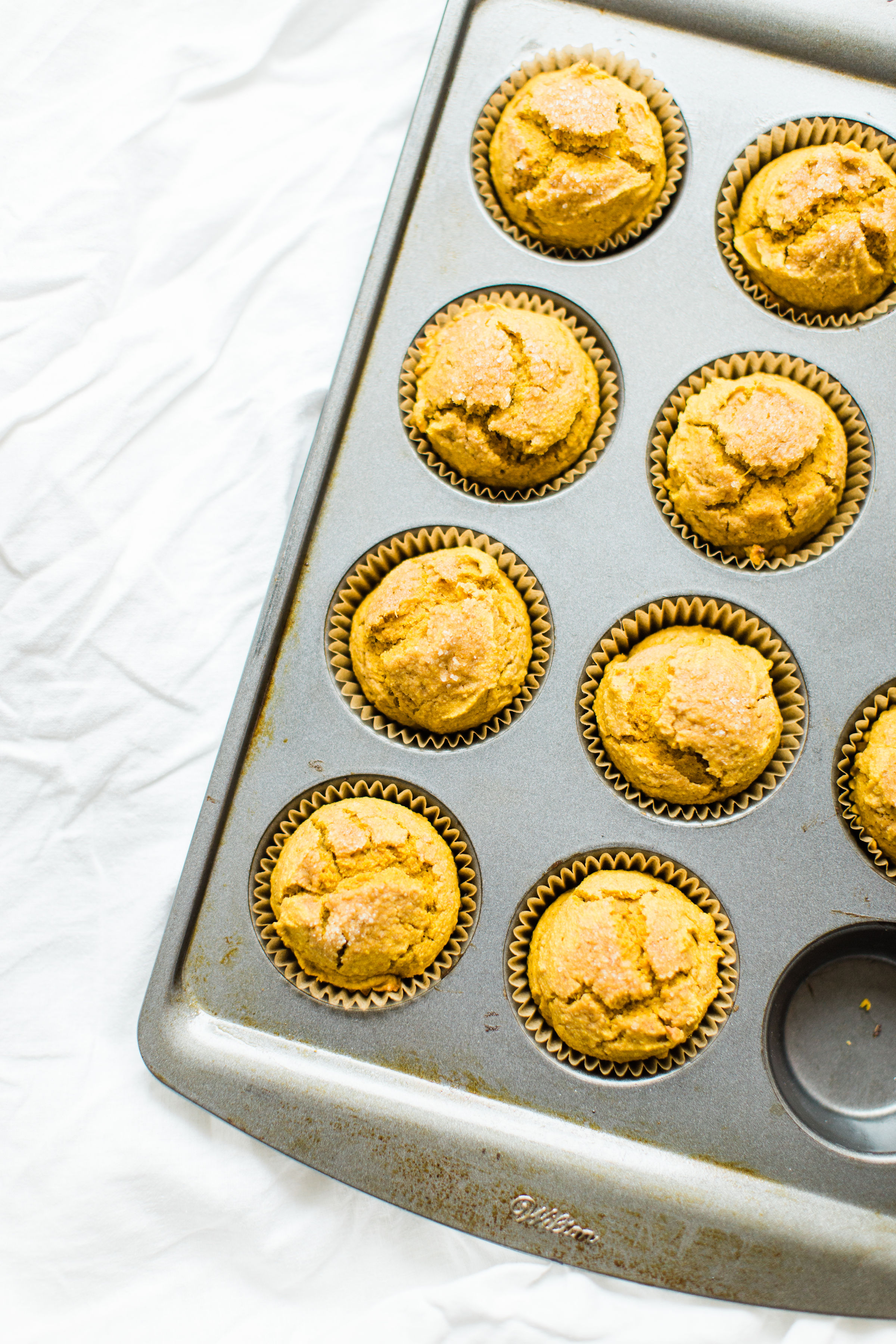 Say hello to your new favorite healthy pumpkin muffins! These naturally gluten-free, dairy-free, sweetened with maple syrup muffins are where it's at! Click through for the recipe. #pumpkinmuffins #healthypumpkinmuffins #fall #falldessert #fallmuffin #thanksgiving #glutenfree #dairyfree #lowsugar | glitterinc.com | @glitterinc