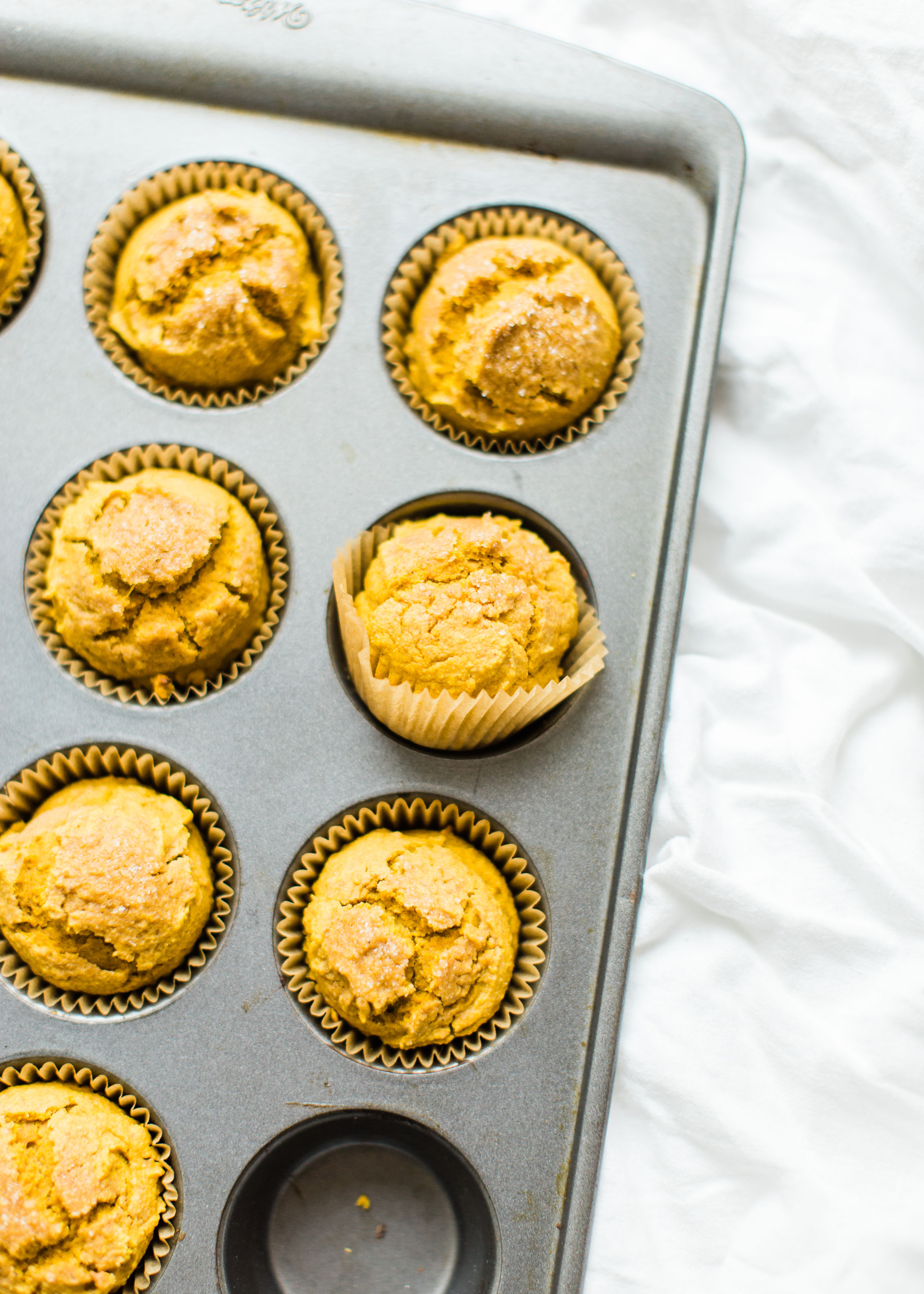 Say hello to your new favorite healthy pumpkin muffins! Full of that fall pumpkin goodness, these naturally gluten-free, dairy-free, sweetened with maple syrup, muffins, are where it's at! Click through for the recipe. #pumpkinmuffins #healthypumpkinmuffins #fall #falldessert #fallmuffin #glutenfree #dairyfree #lowsugar | glitterinc.com | @glitterinc