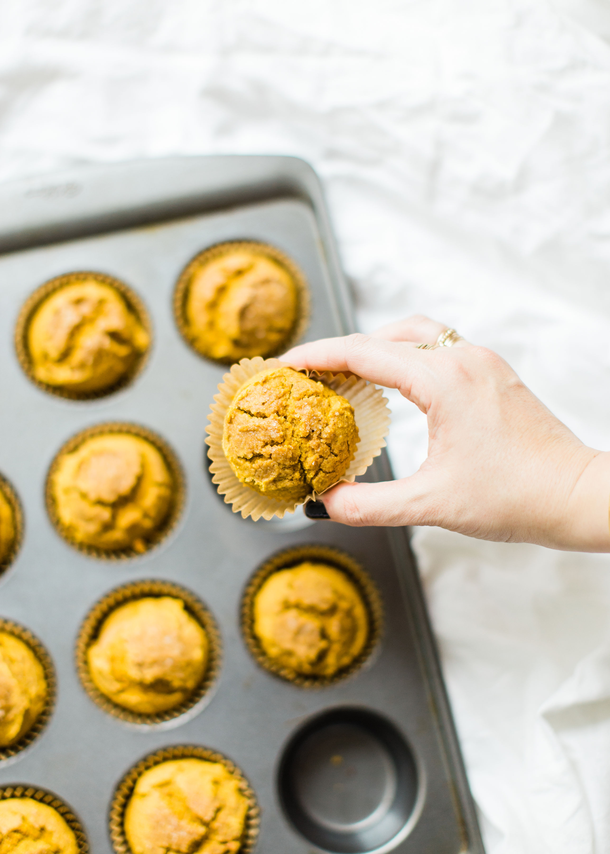 Say hello to your new favorite healthy pumpkin muffins! Full of that fall pumpkin goodness, these naturally gluten-free, dairy-free, sweetened with maple syrup, muffins, are where it's at! Click through for the recipe. #pumpkinmuffins #healthypumpkinmuffins #fall #falldessert #fallmuffin #thanksgiving #glutenfree #dairyfree #lowsugar | glitterinc.com | @glitterinc