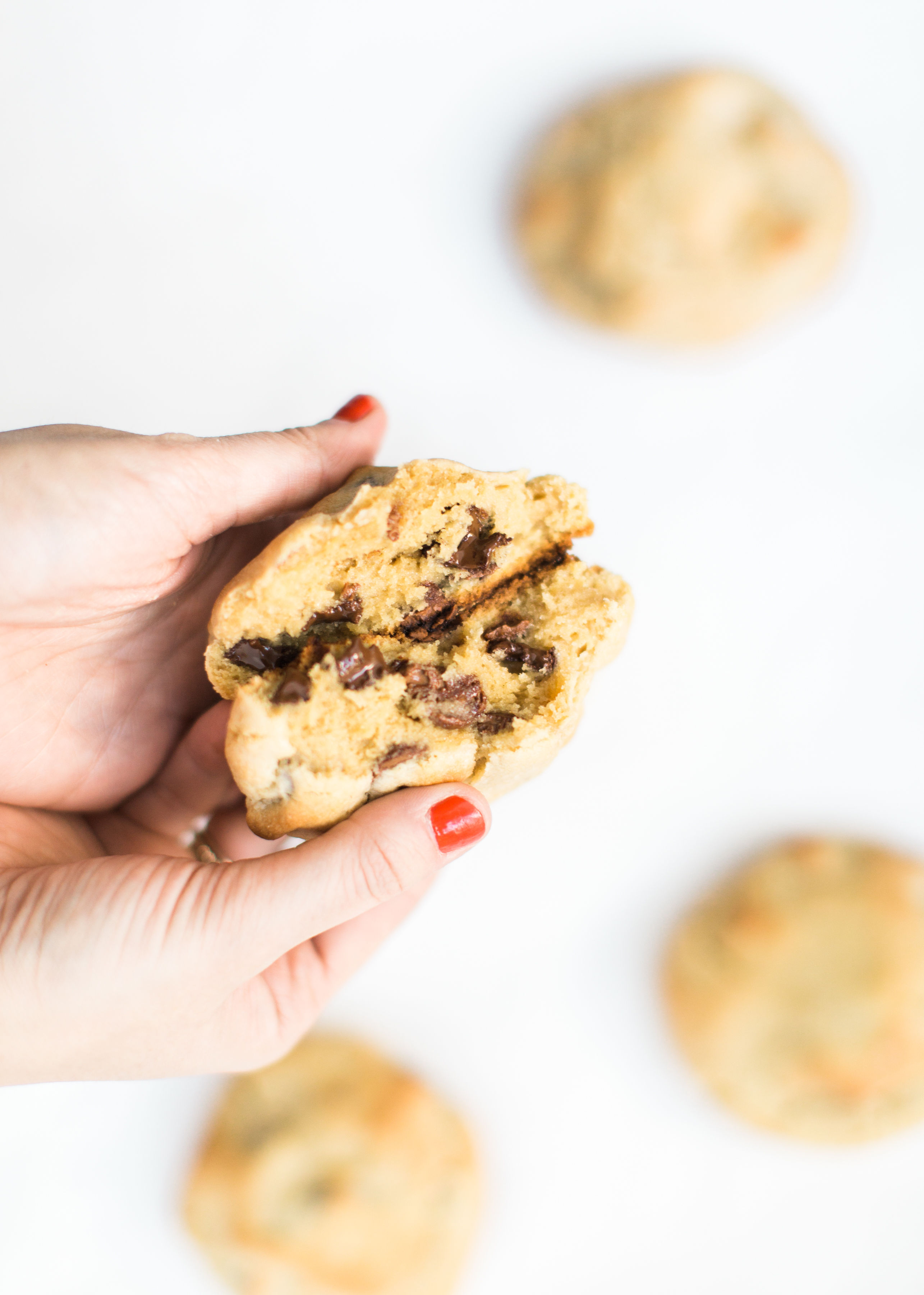 Here it is! The Famous Levain Bakery Chocolate Chip Cookie Recipe that all of New York City is obsessed with; plus a few little tweaks that had our whole family totally crushing on these. You have got to try these super thick, gooey, and decadent #cookies. Click through for the #recipe. #levainbakery #chocolatechipcookies #levainbakerychocolatechipcookies #levainbakerycookies | glitterinc.com | @glitterinc