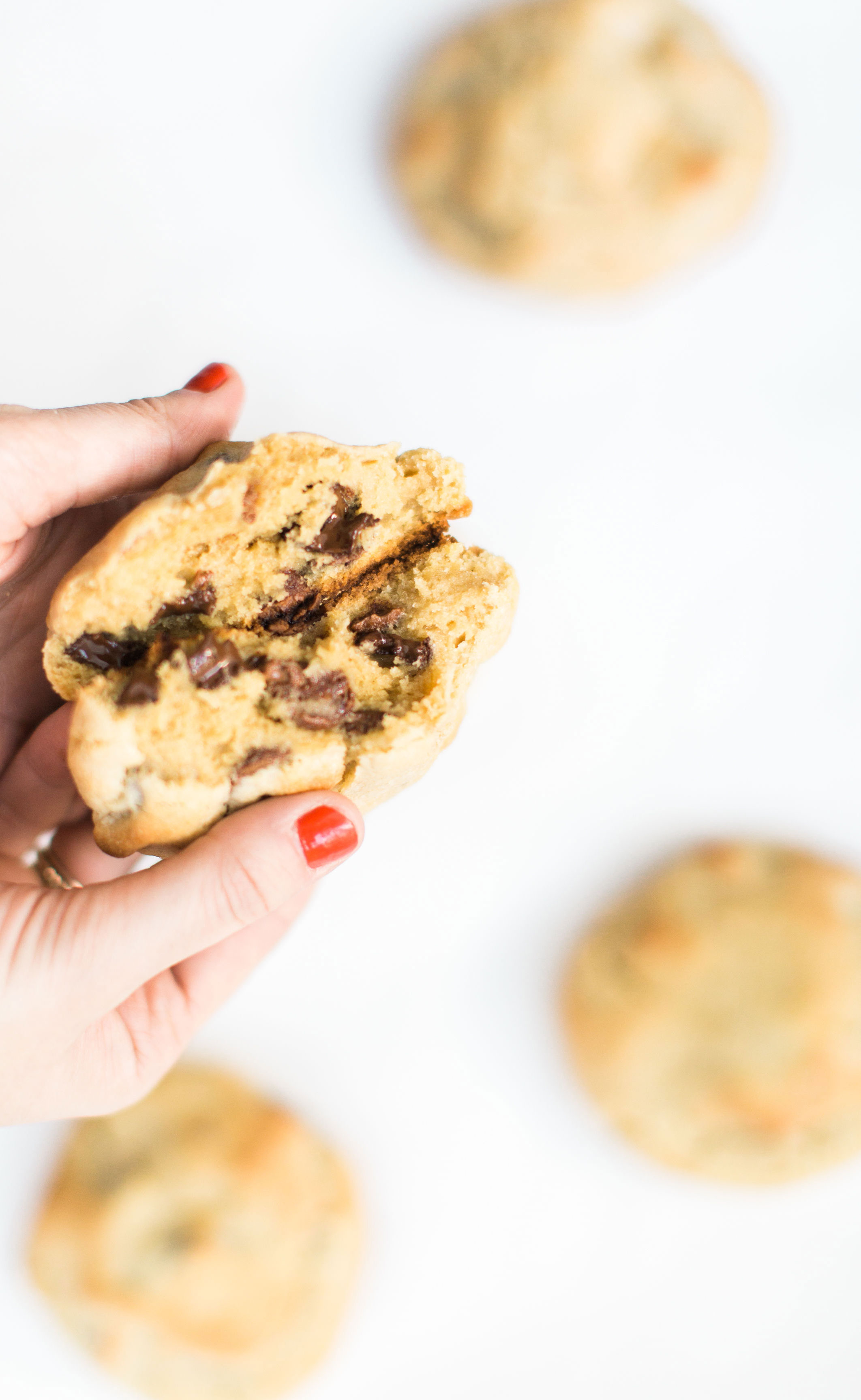 Here it is! The Famous Levain Bakery Chocolate Chip Cookie Recipe that all of New York City is obsessed with; plus a few little tweaks that had our whole family totally crushing on these. You have got to try these super thick, gooey, and decadent #cookies. Click through for the #recipe. #levainbakery #chocolatechipcookies #levainbakerychocolatechipcookies #levainbakerycookies #famouscookies | glitterinc.com | @glitterinc