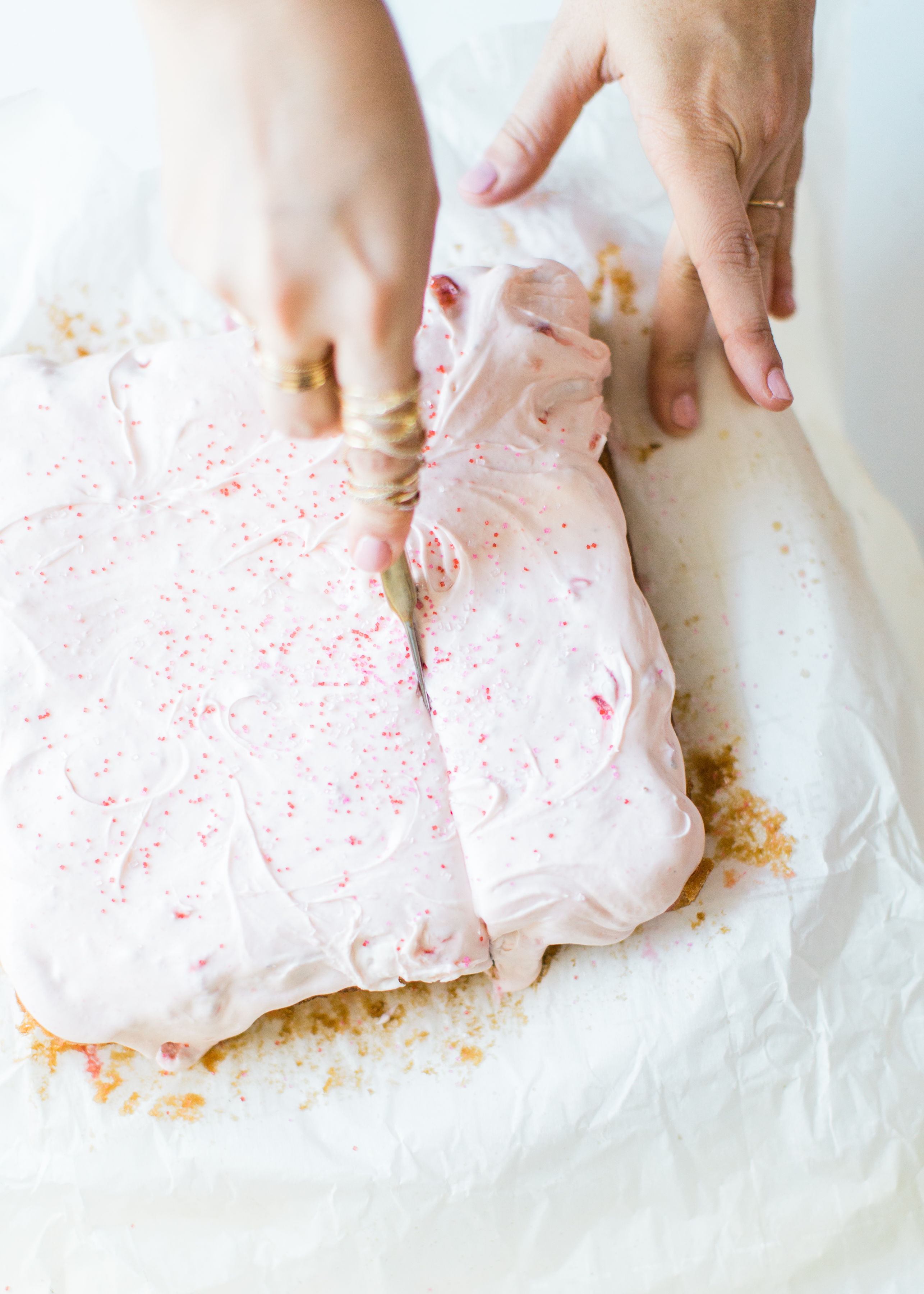 This simple homemade strawberry cake was an instant hit in our house. Easy enough to make with your kids, and bursting with fresh strawberries and topped with a decadent strawberry frosting, you'll be amazed at how moist and delicious this cake is. Click through for the recipe. #strawberrycake #kidsrecipe #easycake #easystrawberrycake #dairyfree #crazycake | glitterinc.com | @glitterinc