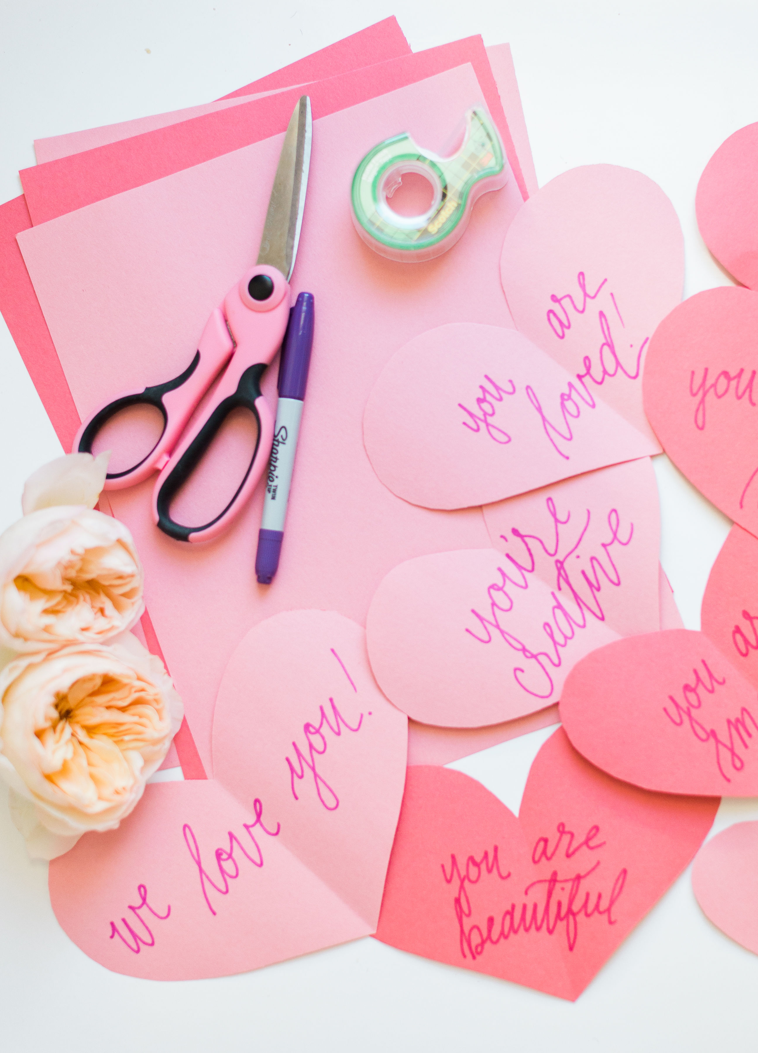 A DIY heart attack - paper hearts spelling out the reasons you love your Valentine - are sure to surprise and delight kids and grown-ups alike! | glitterinc.com | @glitterinc