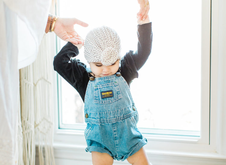 baby girl wearing overalls