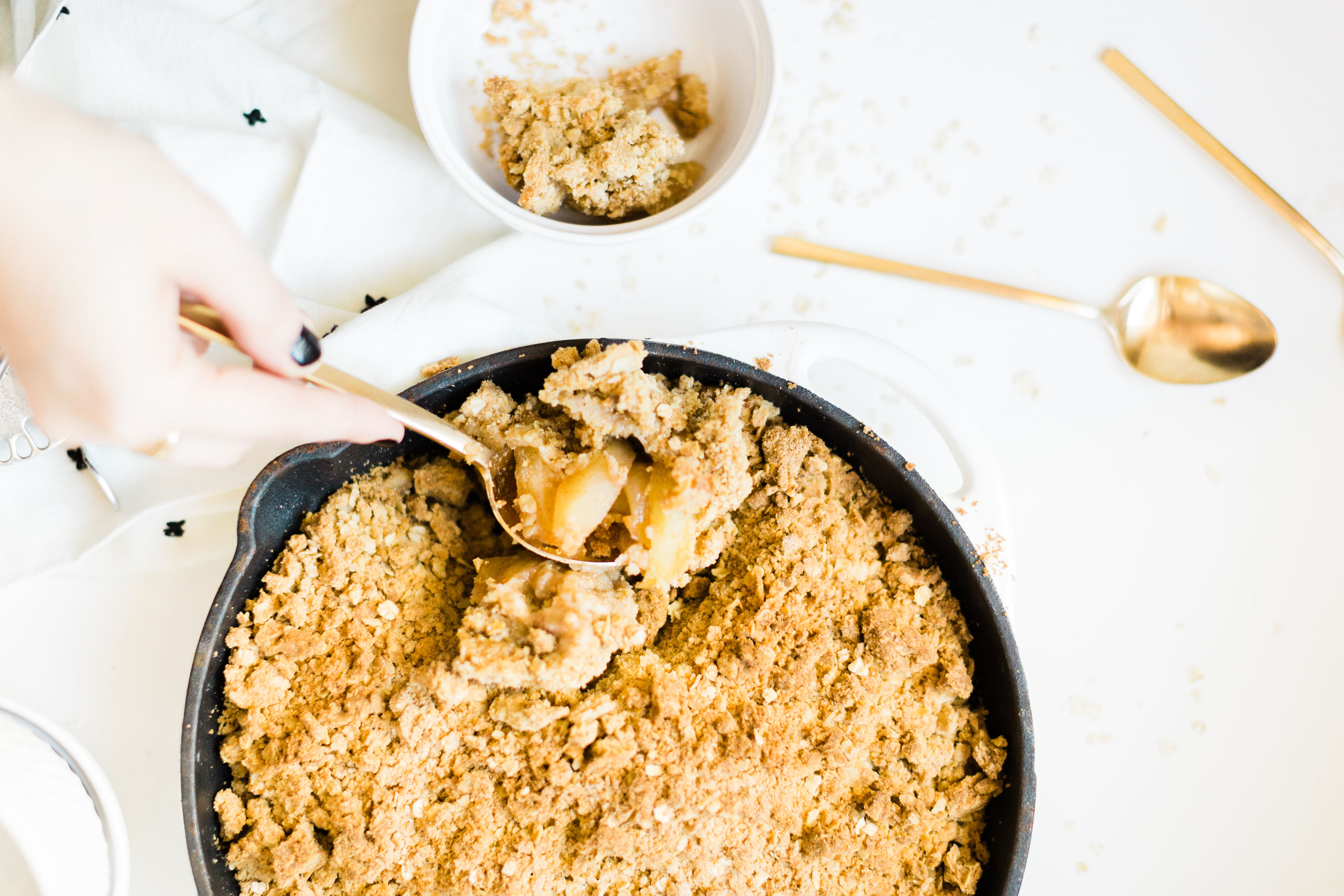 This amazing skillet apple crumble is filled with juicy apples baked into sticky, caramel-y, gooey perfection, and topped with a buttery crisp meets crumble topping that is decadently crumbly, a little bit doughy, with plenty of crunch. 