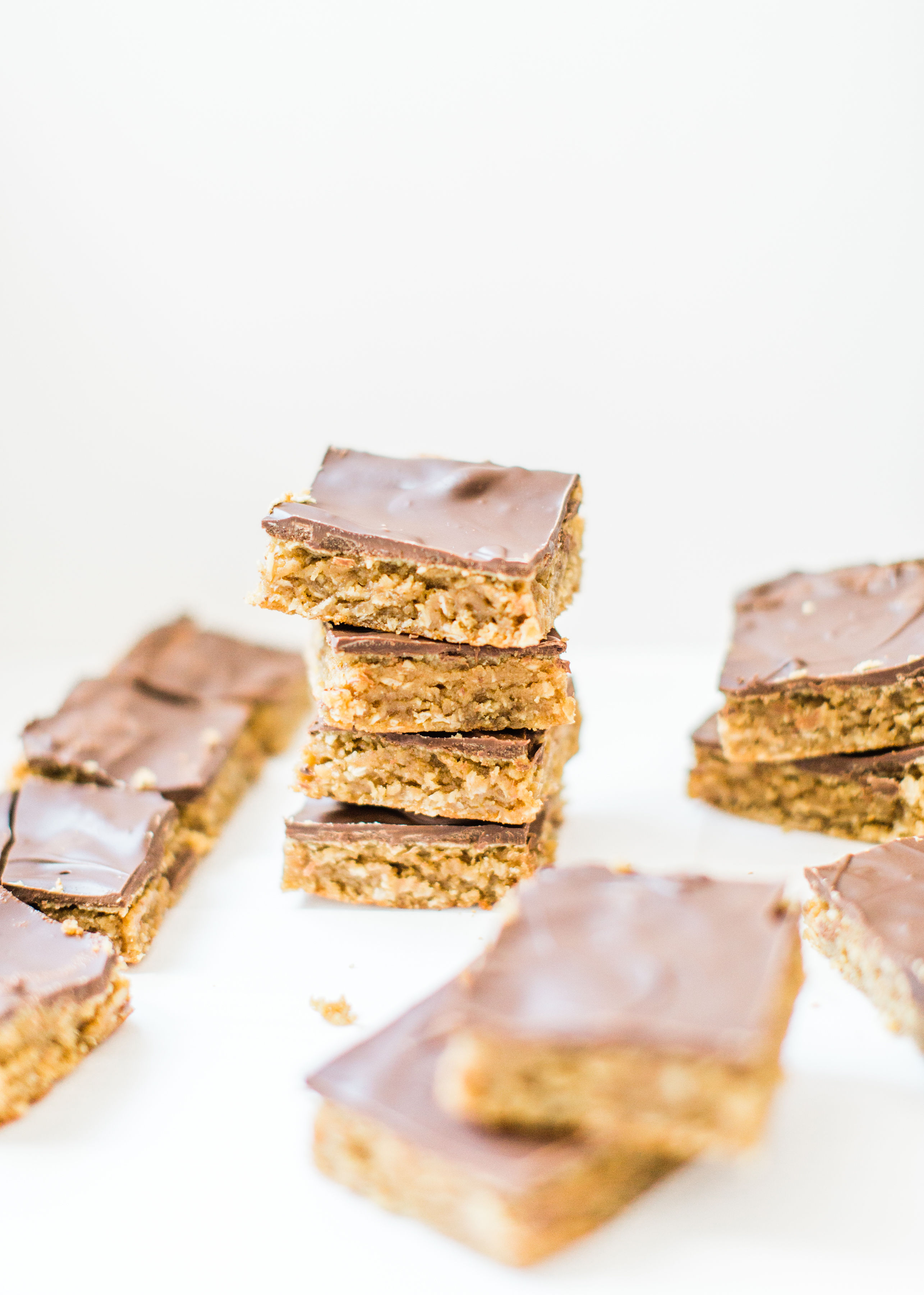 Sheet pan chocolate peanut butter oatmeal cookie bars are simple to whip up, incredibly yummy, and can easily feed a crowd. These easy cookies are a total fan favorite! Click through for the recipe. | glitterinc.com | @glitterinc