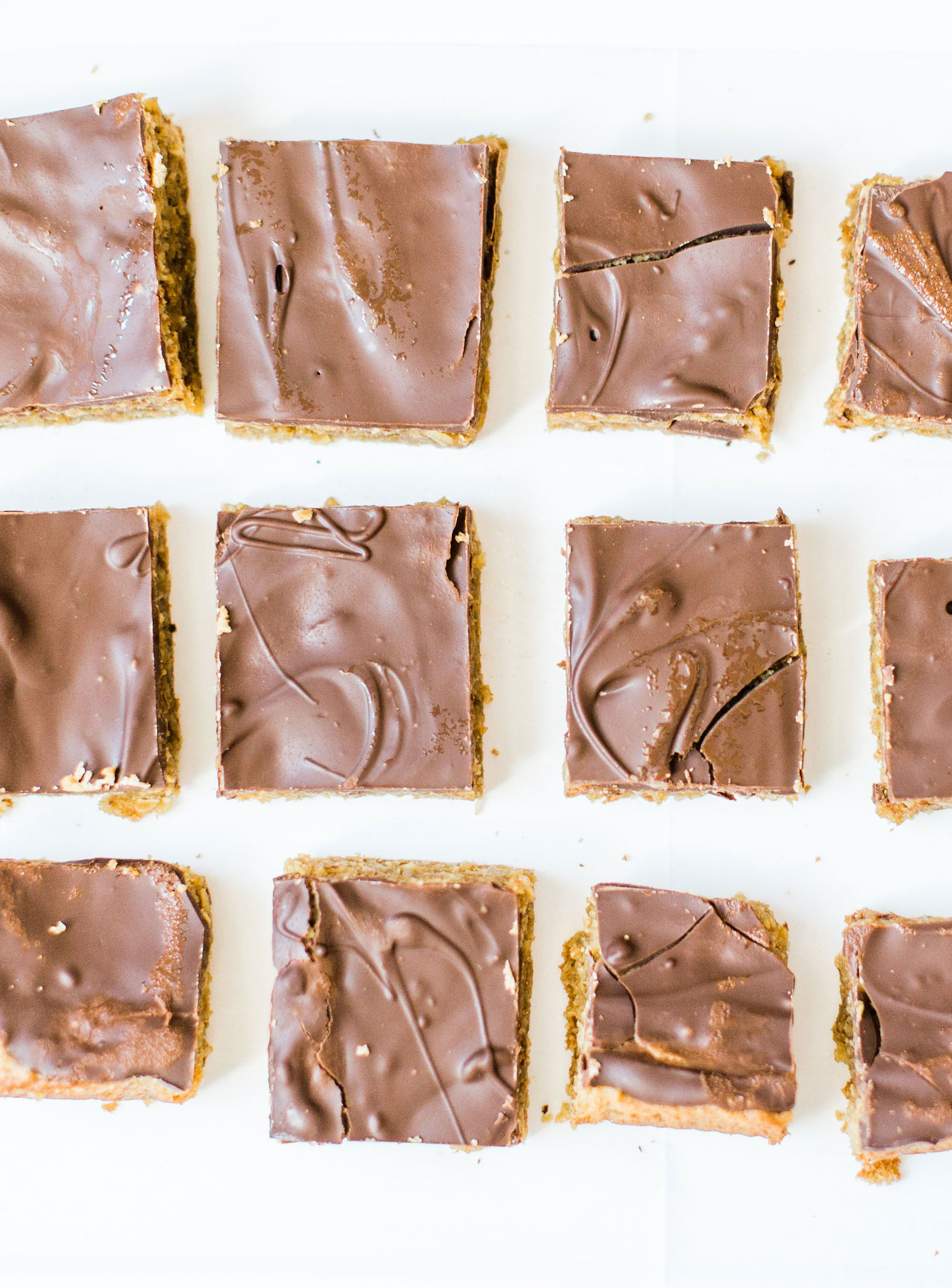 Sheet pan chocolate peanut butter oatmeal cookie bars are simple to whip up, incredibly yummy, and can easily feed a crowd. These easy cookies are a total fan favorite! Click through for the recipe. | glitterinc.com | @glitterinc