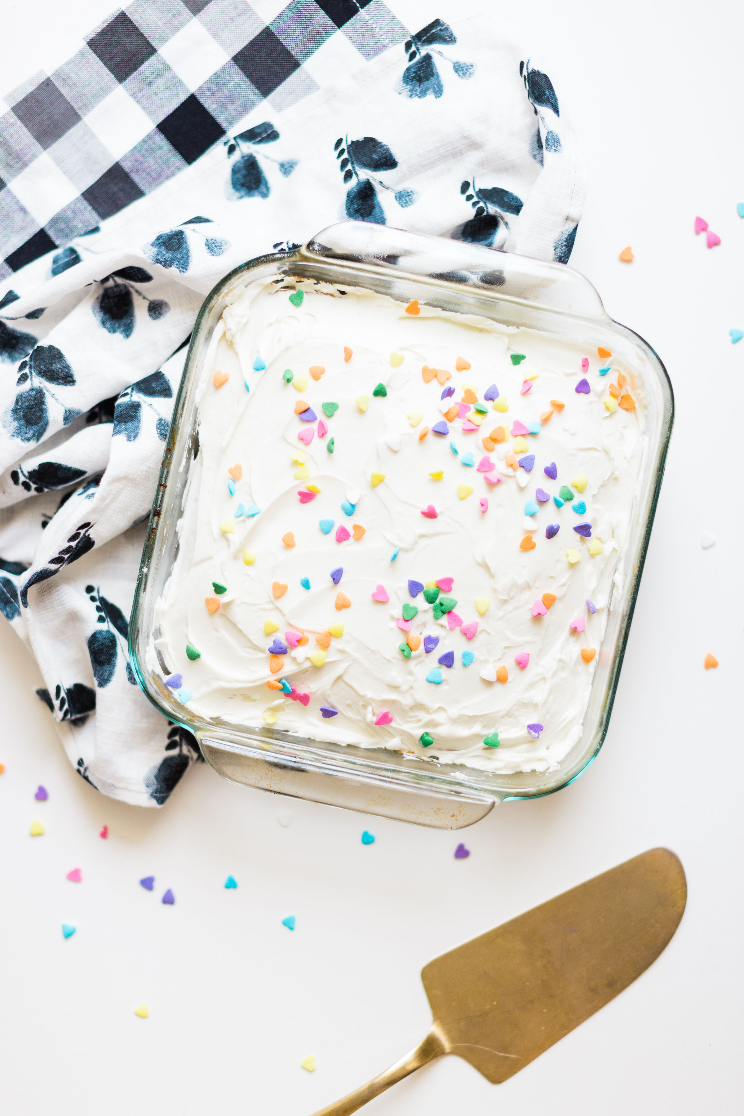 This simple homemade vanilla sheet cake is moist, fluffy, yummy, and dairy-free/vegan, can be made all in one baking pan, comes out perfect every single time, and is way better than boxed cake mix. Click through for the recipe. | glitterinc.com | @glitterinc