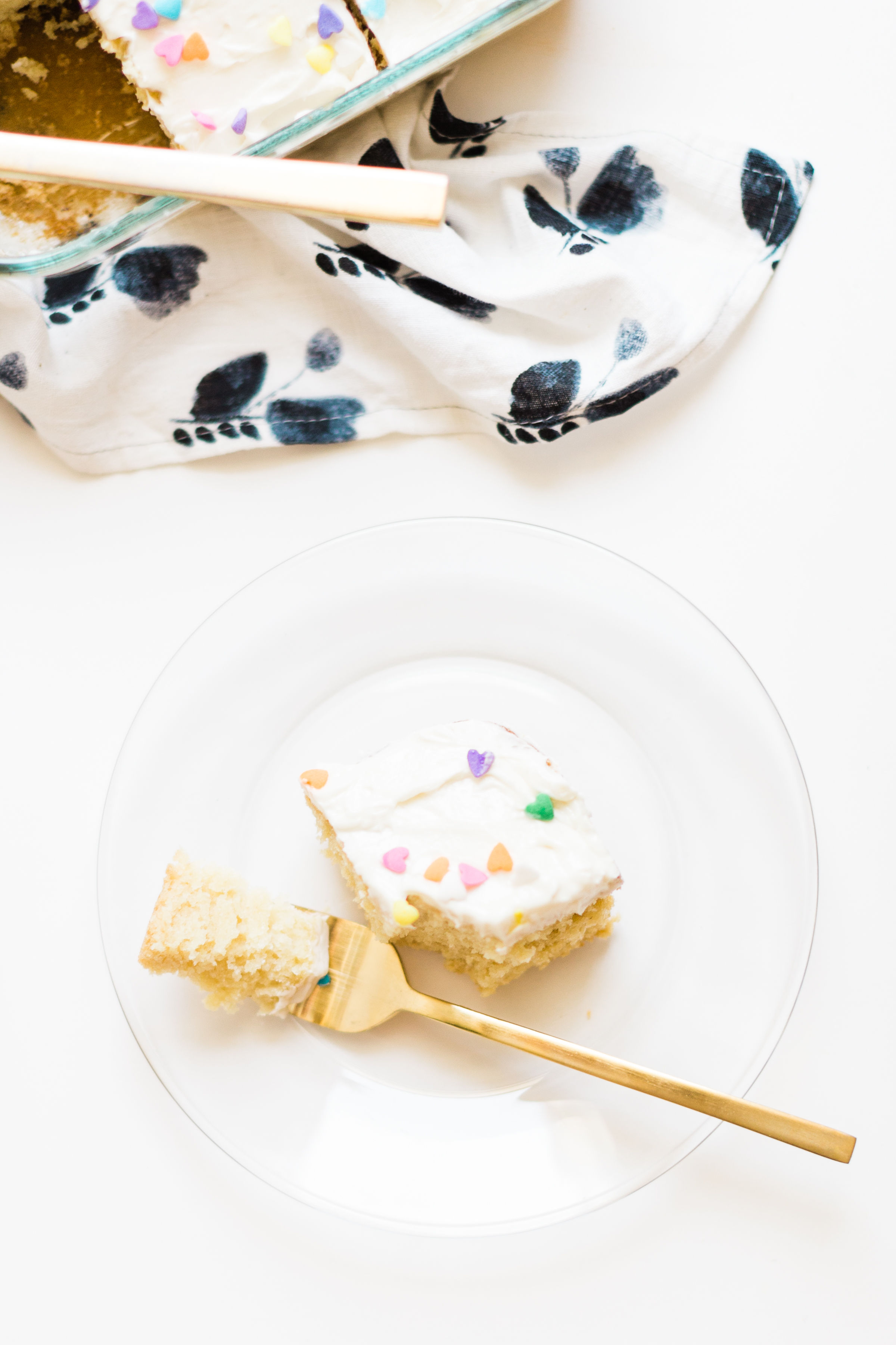 This simple homemade vanilla sheet cake is moist, fluffy, yummy, and dairy-free/vegan, can be made all in one baking pan, comes out perfect every single time, and is way better than boxed cake mix. Click through for the recipe. | glitterinc.com | @glitterinc