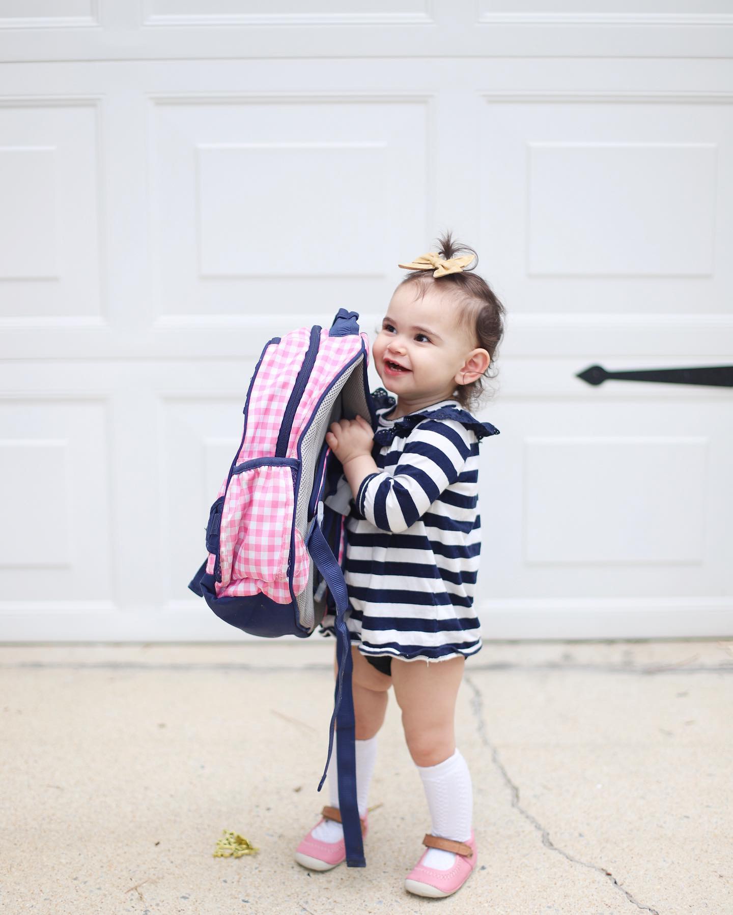 A Big Week of Last Days -  Baby girl is wearing a striped dress 