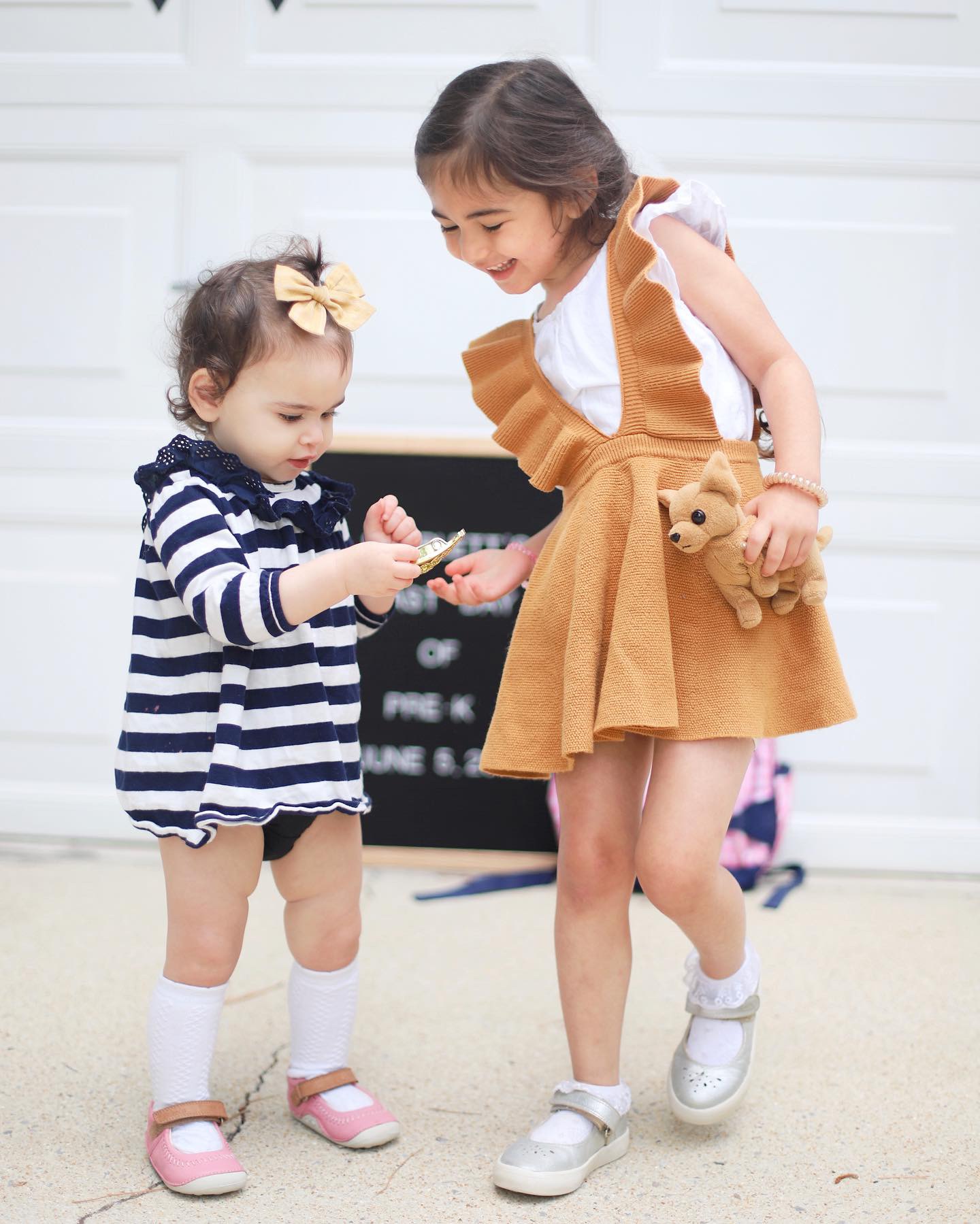 Sisters wearing cute outfits