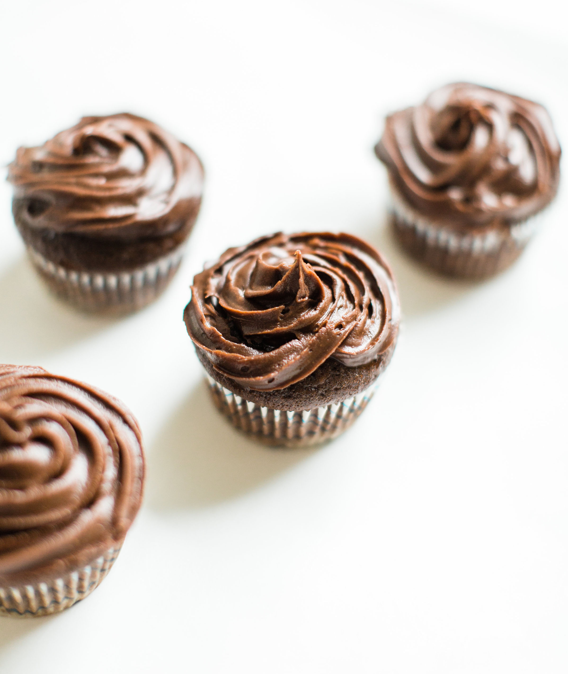 Make these fluffy, moist, and delicious chocolate cupcakes with our favorite chocolate crazy cake recipe. These easy egg-free and dairy-free cupcakes are perfect for your next party! | glitterinc.com | @glitterinc