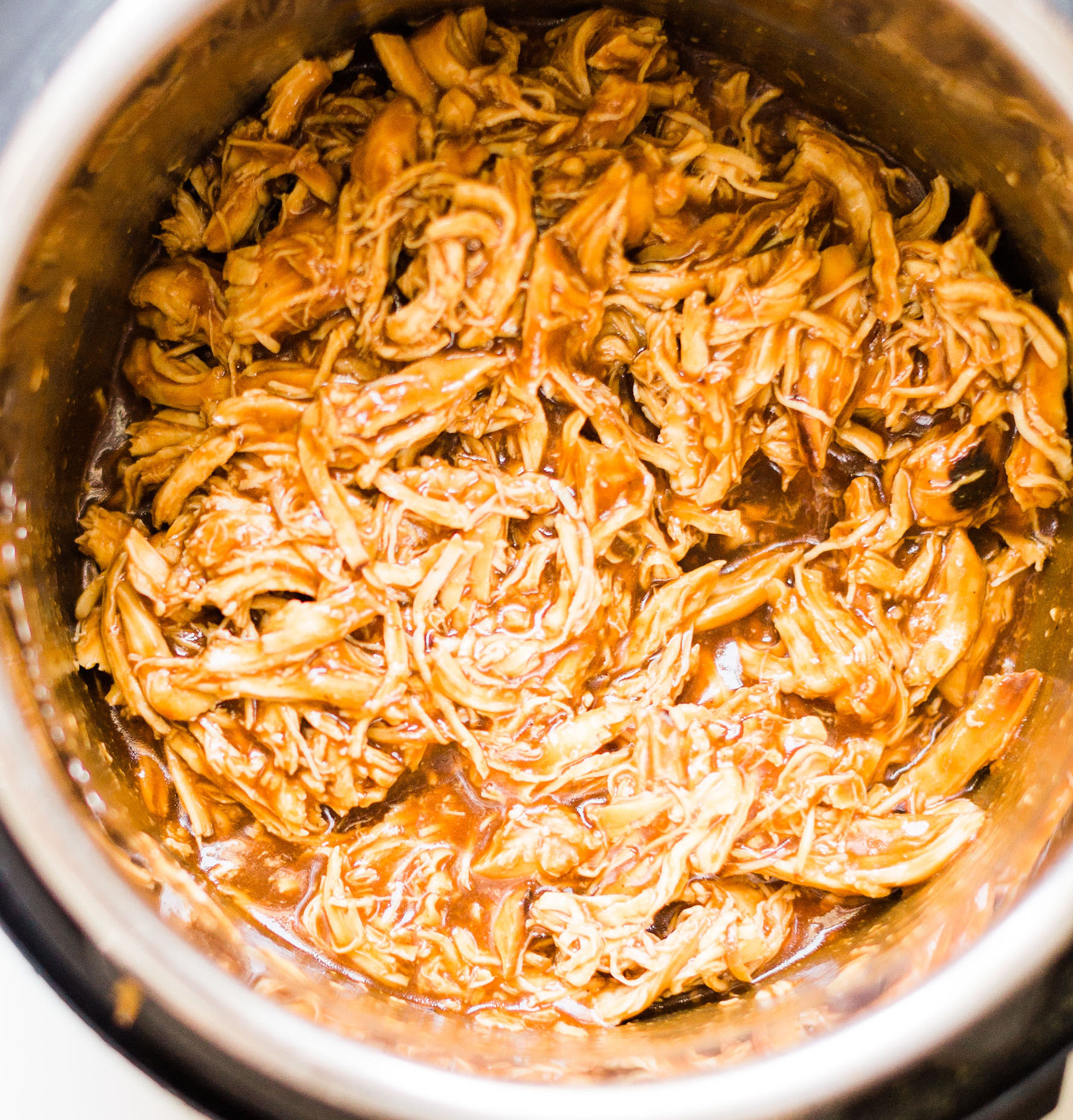 Crockpot BBQ Pulled Chicken. Yum! Click through for the BBQ recipe. | glitterinc.com | @glitterinc