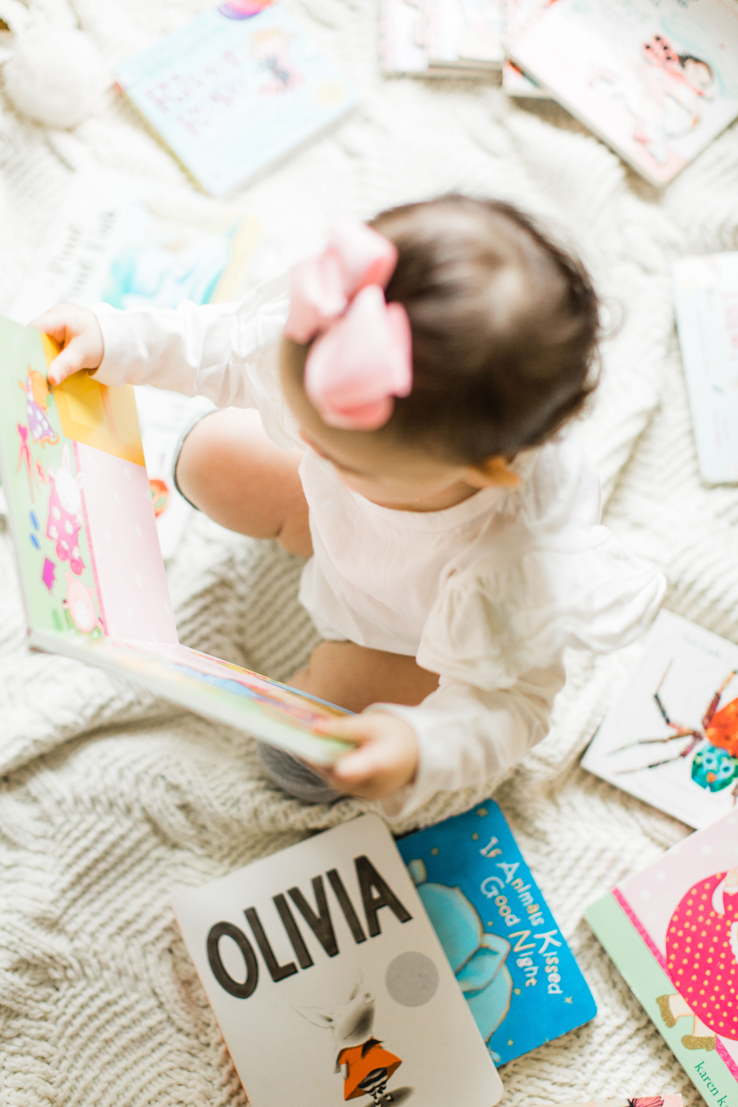 Sale on Children's Books at Amazon, baby playing with books