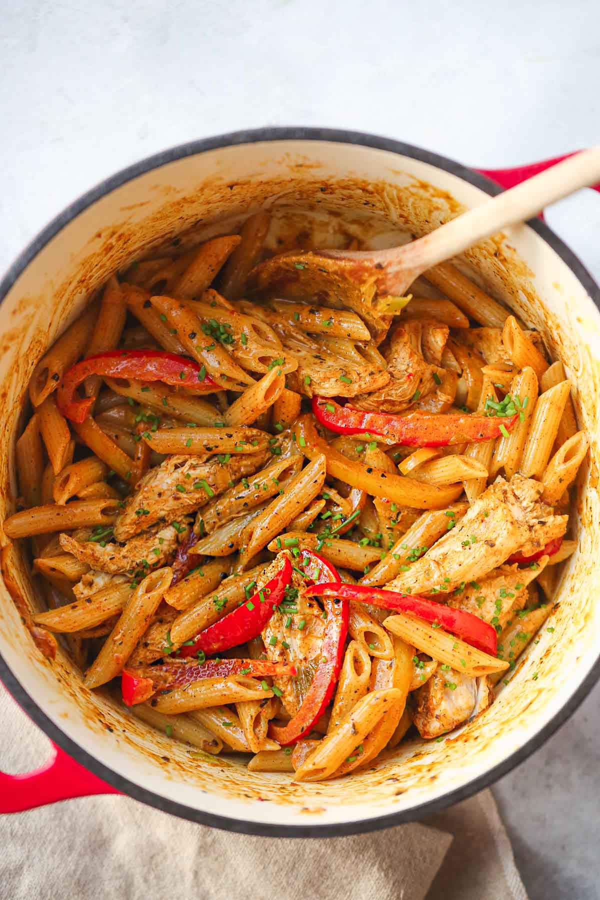 Rasta pasta is creamy pasta tossed with Caribbean style jerk chicken and sauteed bell peppers