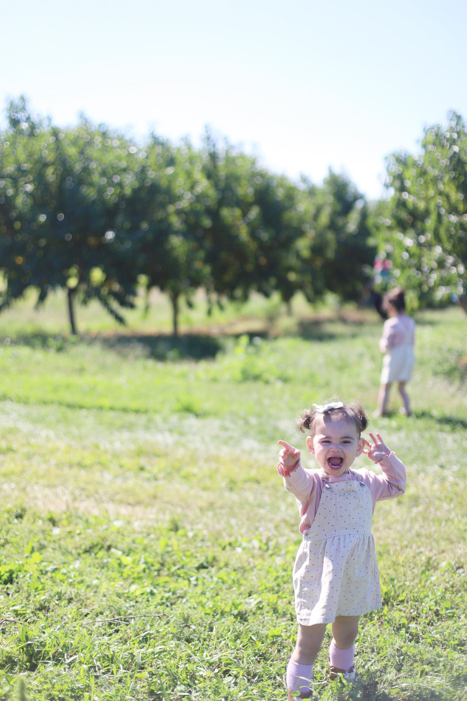 A happy little girl at Brooksby Farm in Peabody, Massachusetts // Fall Bucket List | glitterinc.com | @glitterinc