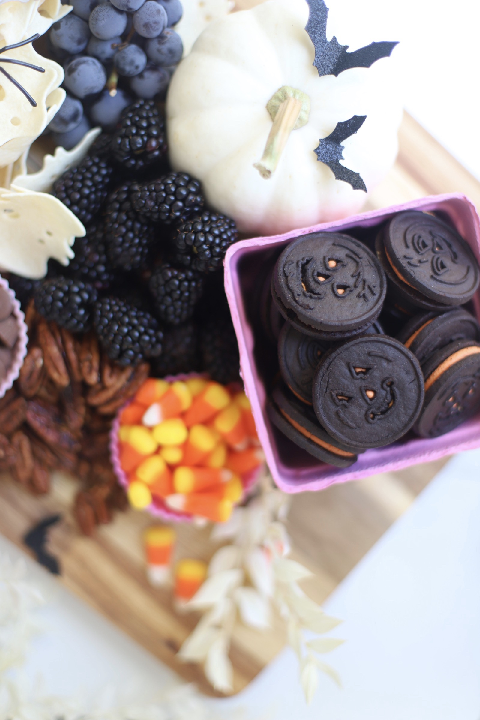 Serve a beautifully spooky Halloween charcuterie board chock full of snacks the whole family will love! This frightfully delicious snack board is perfect for Halloween celebrations, a no-fuss dinner after a night of trick-or-treating, even a festive afternoon snack throughout the month of October. Happy snacking! | glitterinc.com | @glitterinc