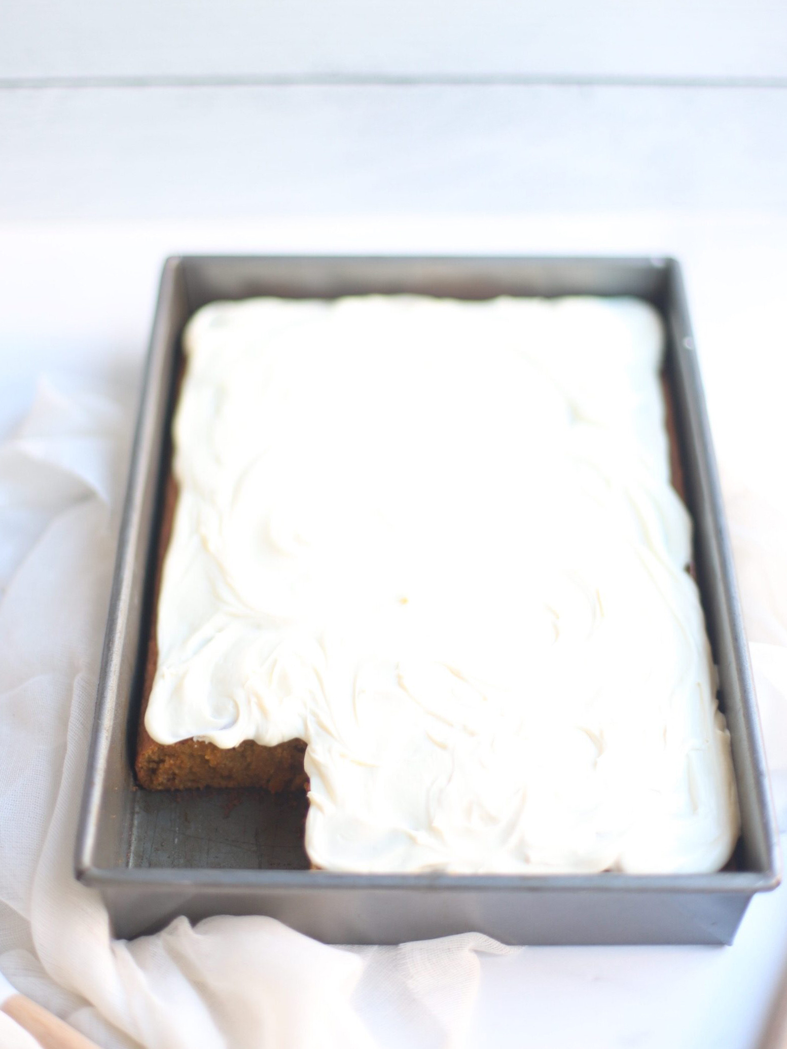 A total crowdpleaser, this gluten-free pumpkin sheet cake with cream cheese frosting is so simple to make and unbelievably yummy. And can easily be made dairy free. The end result tastes like everything good about fall! Click through for the recipe. | glitterinc.com | @glitterinc