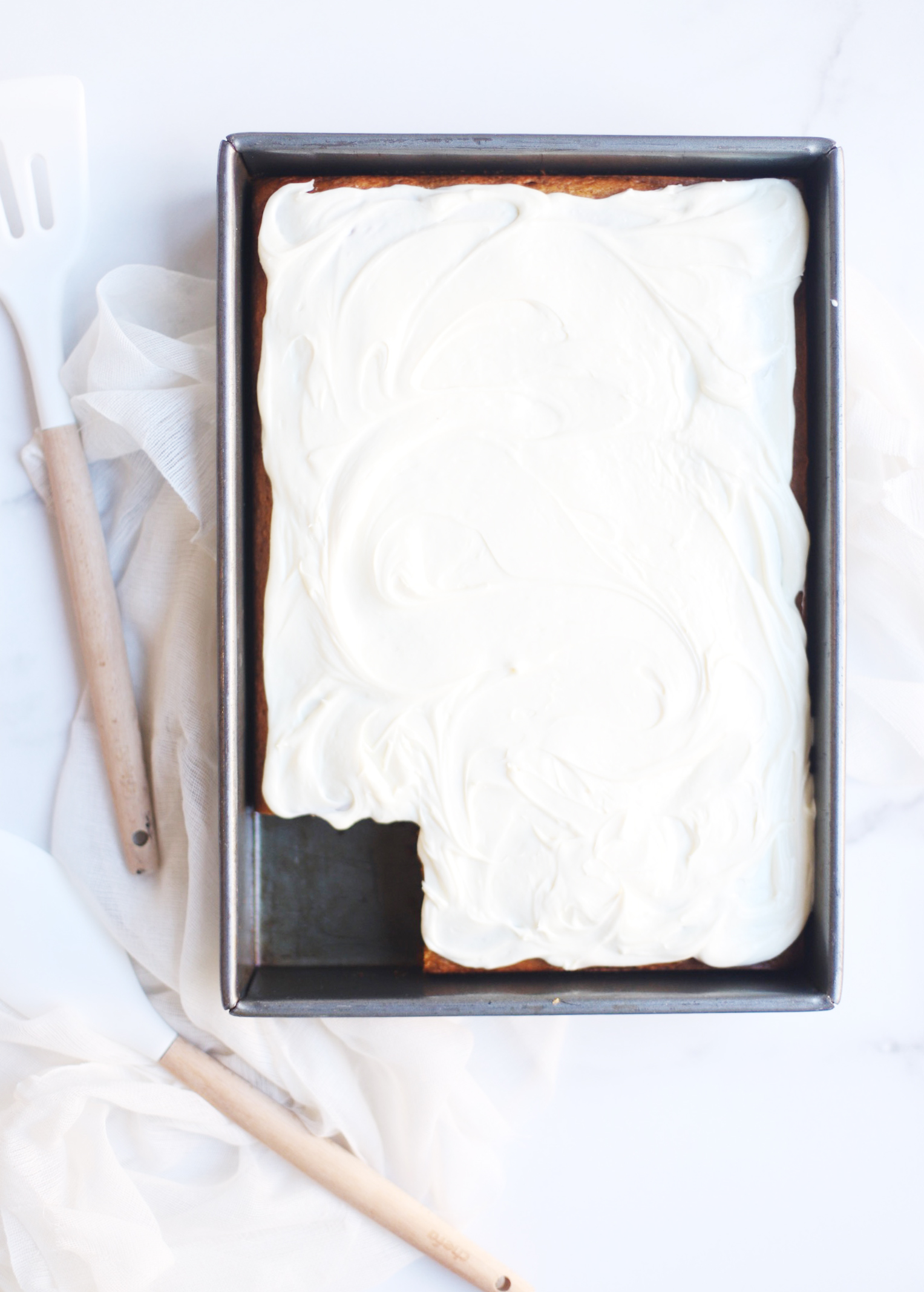 A total crowdpleaser, this gluten-free pumpkin sheet cake with cream cheese frosting is so simple to make and unbelievably yummy. And can easily be made dairy free. The end result tastes like everything good about fall! Click through for the recipe. | glitterinc.com | @glitterinc