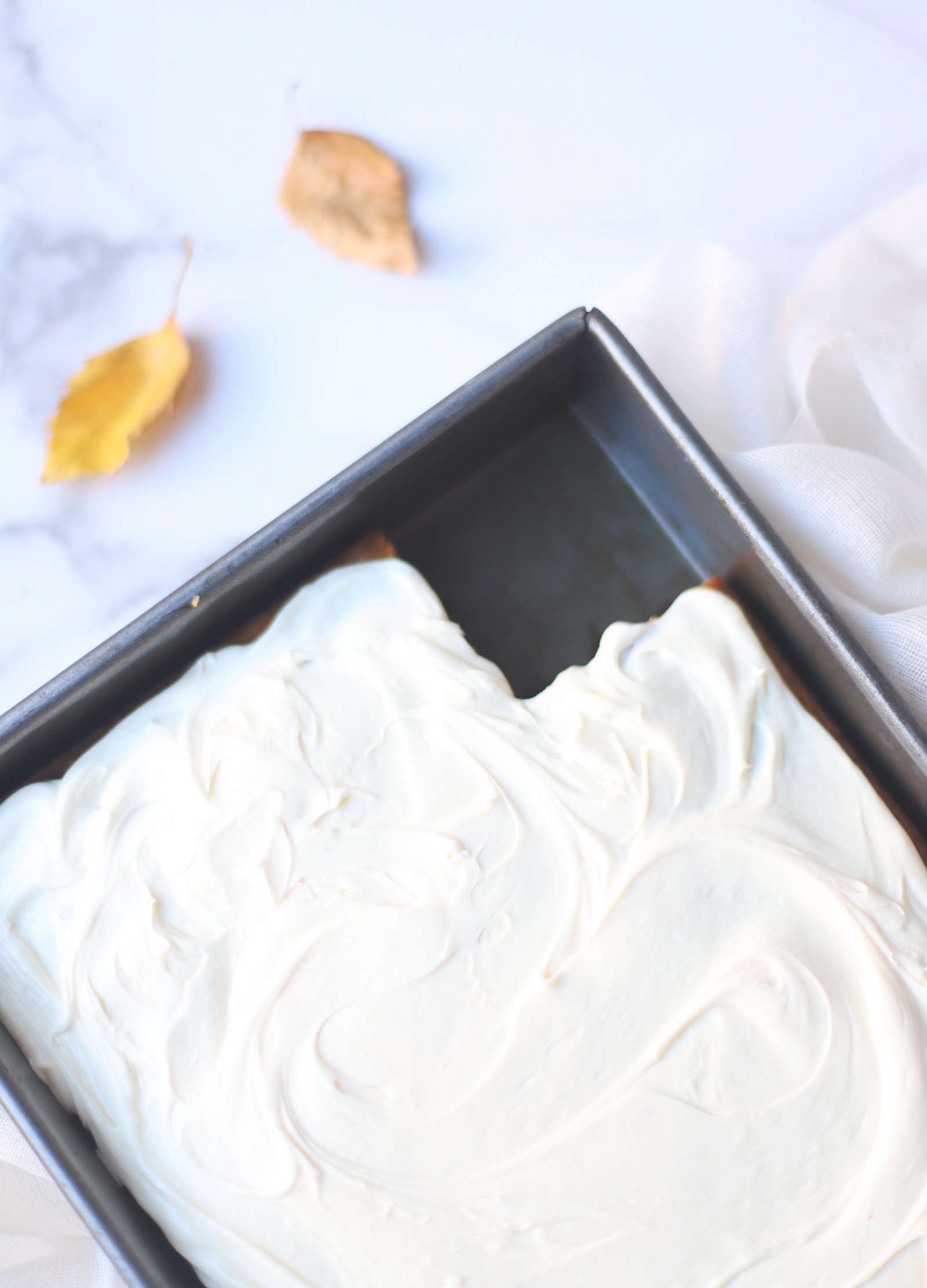 A total crowdpleaser, this gluten-free pumpkin sheet cake with cream cheese frosting is so simple to make and unbelievably yummy. And can easily be made dairy free. The end result tastes like everything good about fall! Click through for the recipe. | glitterinc.com | @glitterinc