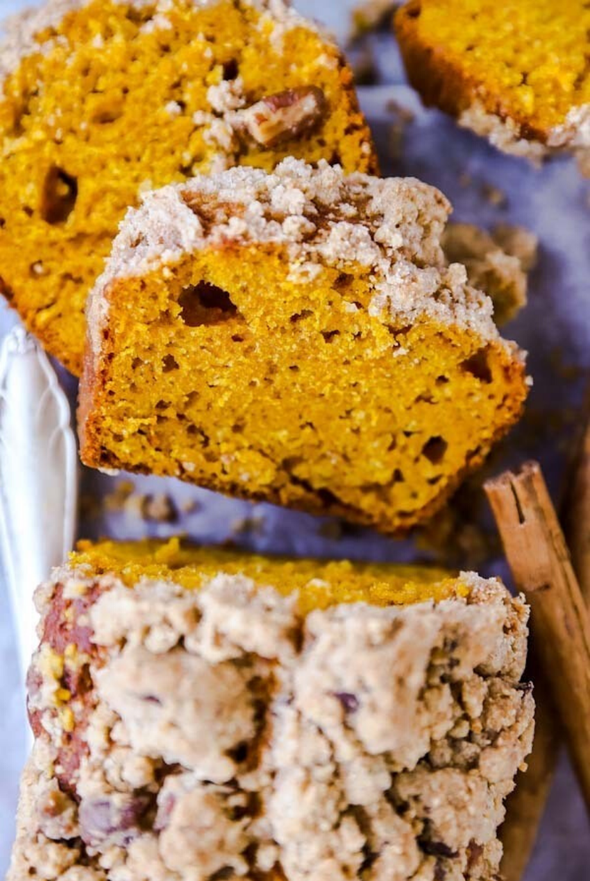 These delicious snacks, packed with the season's best fall flavors, will keep you and your family happily snacking all fall long! Click through for the recipes. | glitterinc.com | @glitterinc // Cinnamon Pecan Streusel Pumpkin Bread 