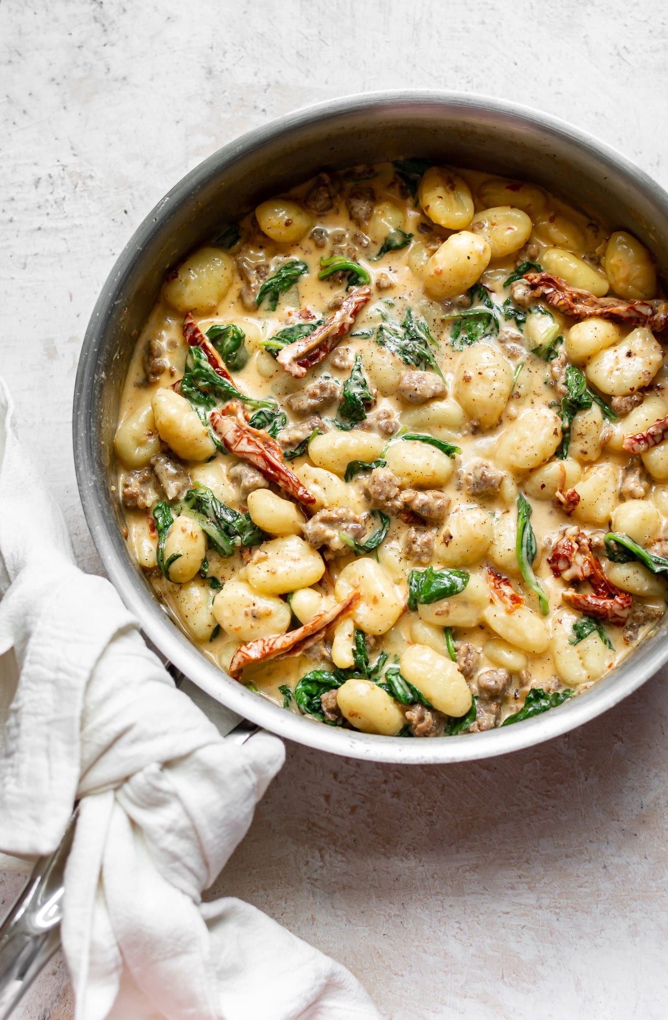 What better way to celebrate a big birthday than with a delicious, home cooked meal? Click through for 40 delicious birthday dinner ideas to celebrate that special someone at home. #recipes | glitterinc.com | @glitterinc // Creamy Tuscan Sausage Gnocchi