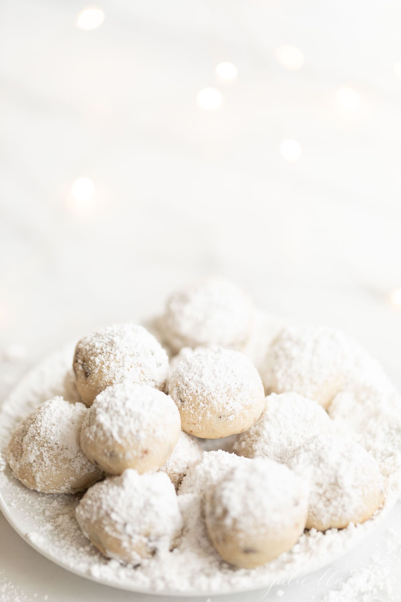 Chocolate Chip Pecan Snowball Cookies, plus how to throw a Christmas cookie exchange this holiday season! These hosting tips will help you to plan one awesome cookie swap party, including more than 40 recipes for our favorite holiday cookies ever! | glitterinc.com | @glitterinc