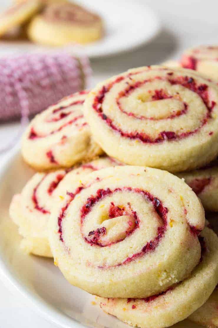 Cranberry Orange Swirl Cookies, plus how to throw a Christmas cookie exchange this holiday season! These hosting tips will help you to plan one awesome cookie swap party, including more than 40 recipes for our favorite holiday cookies ever! | glitterinc.com | @glitterinc