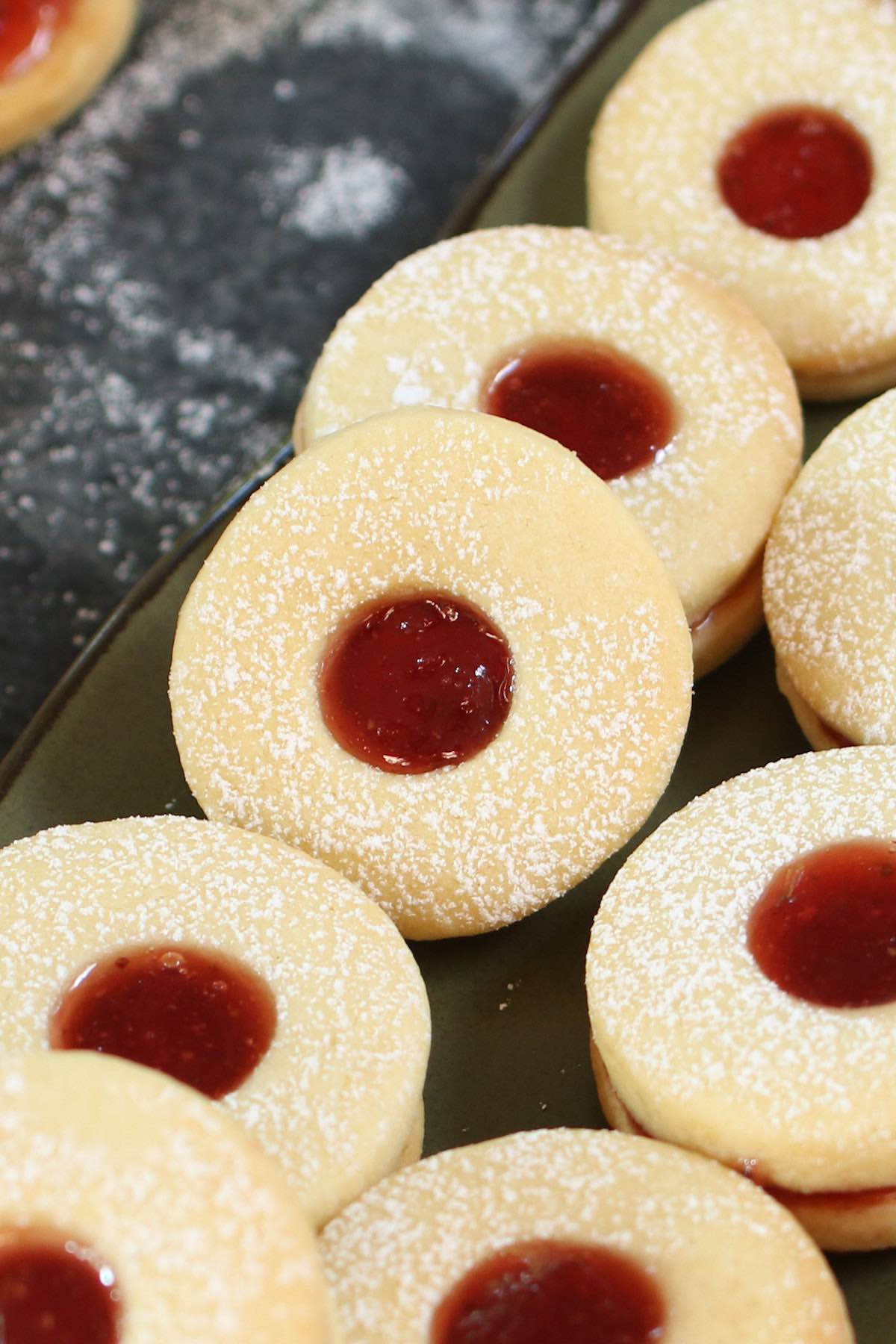 Homemade Jammie Dodgers, plus how to throw a Christmas cookie exchange this holiday season! These hosting tips will help you to plan one awesome cookie swap party, including more than 40 recipes for our favorite holiday cookies ever! | glitterinc.com | @glitterinc