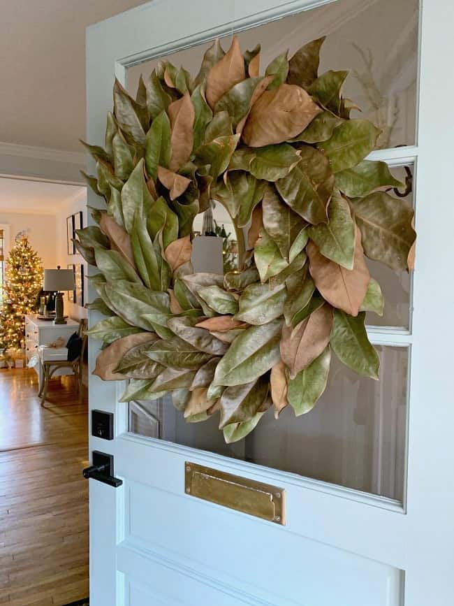 Decorating your house for Christmas? These 4 beautiful and unique Holiday home tours are sure to get you inspired this holiday season! | glitterinc.com | @glitterinc // Rustic Holiday Home Tour // Magnolia Wreath on a Farmhouse Front Door