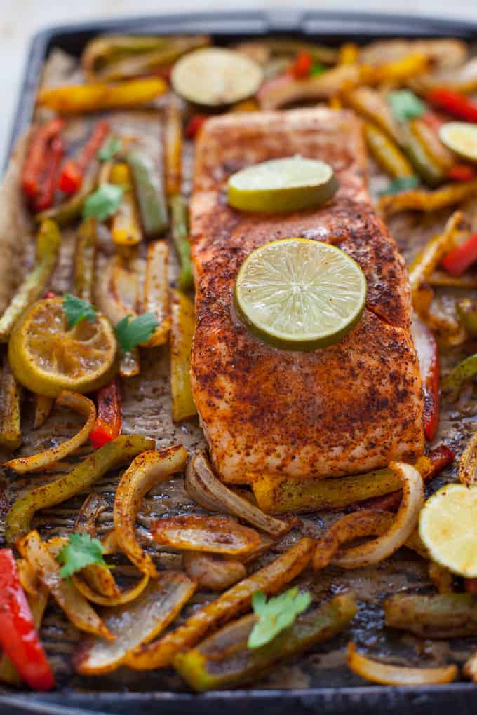 These sheet pan salmon fajitas are perfect for a quick weeknight dinner with minimal cleanup! Can you say Taco Tuesday? Or, better yet, Fajita Friday?