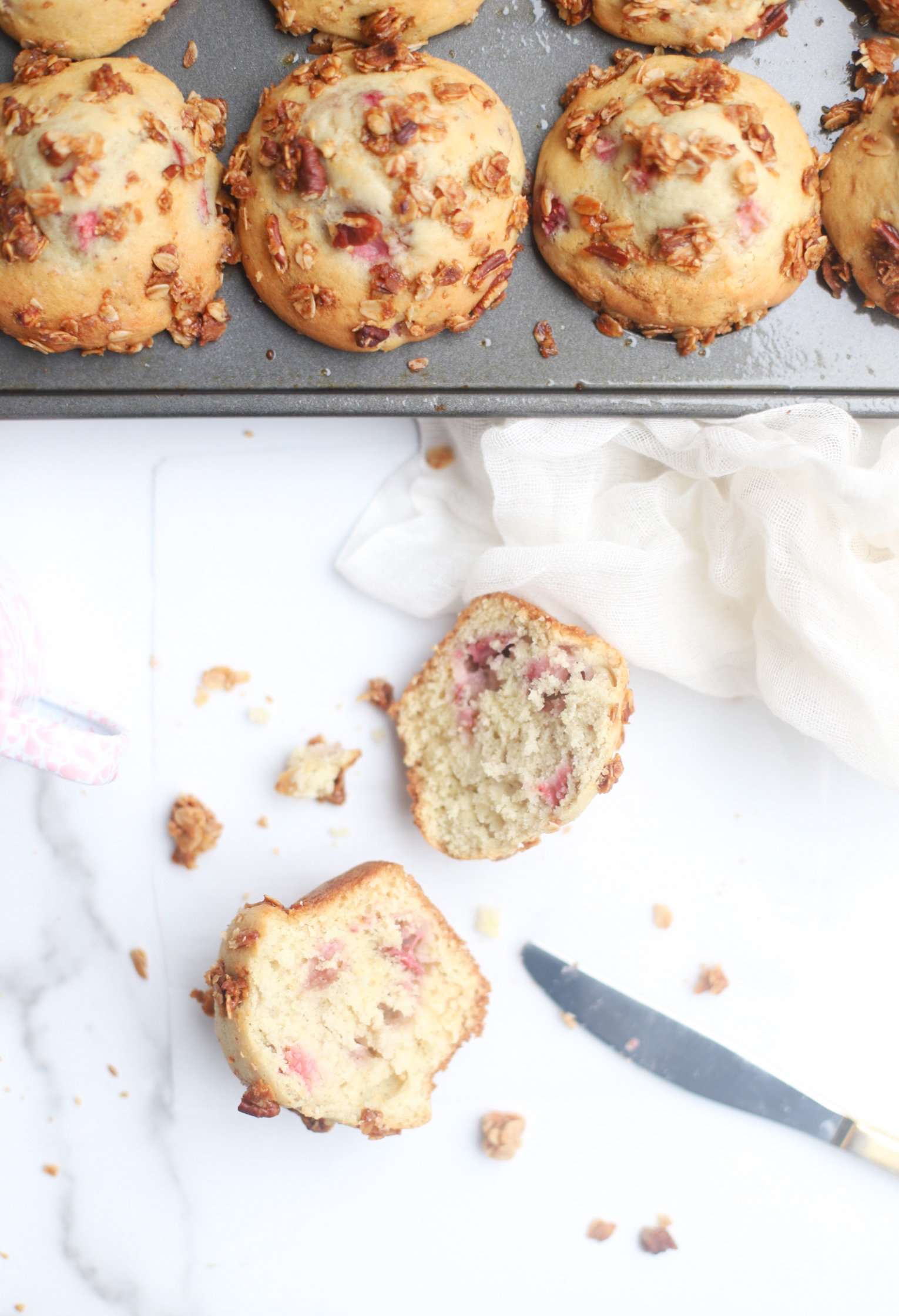 Bake up a batch of these decadently fluffy and moist bakery-style Strawberry Yogurt Granola Crumble Muffins, made with rich Greek yogurt, full of fresh strawberry flavor, and topped with our favorite homemade classic granola crumble. Click through for the recipe. | glitterinc.com | @glitterinc