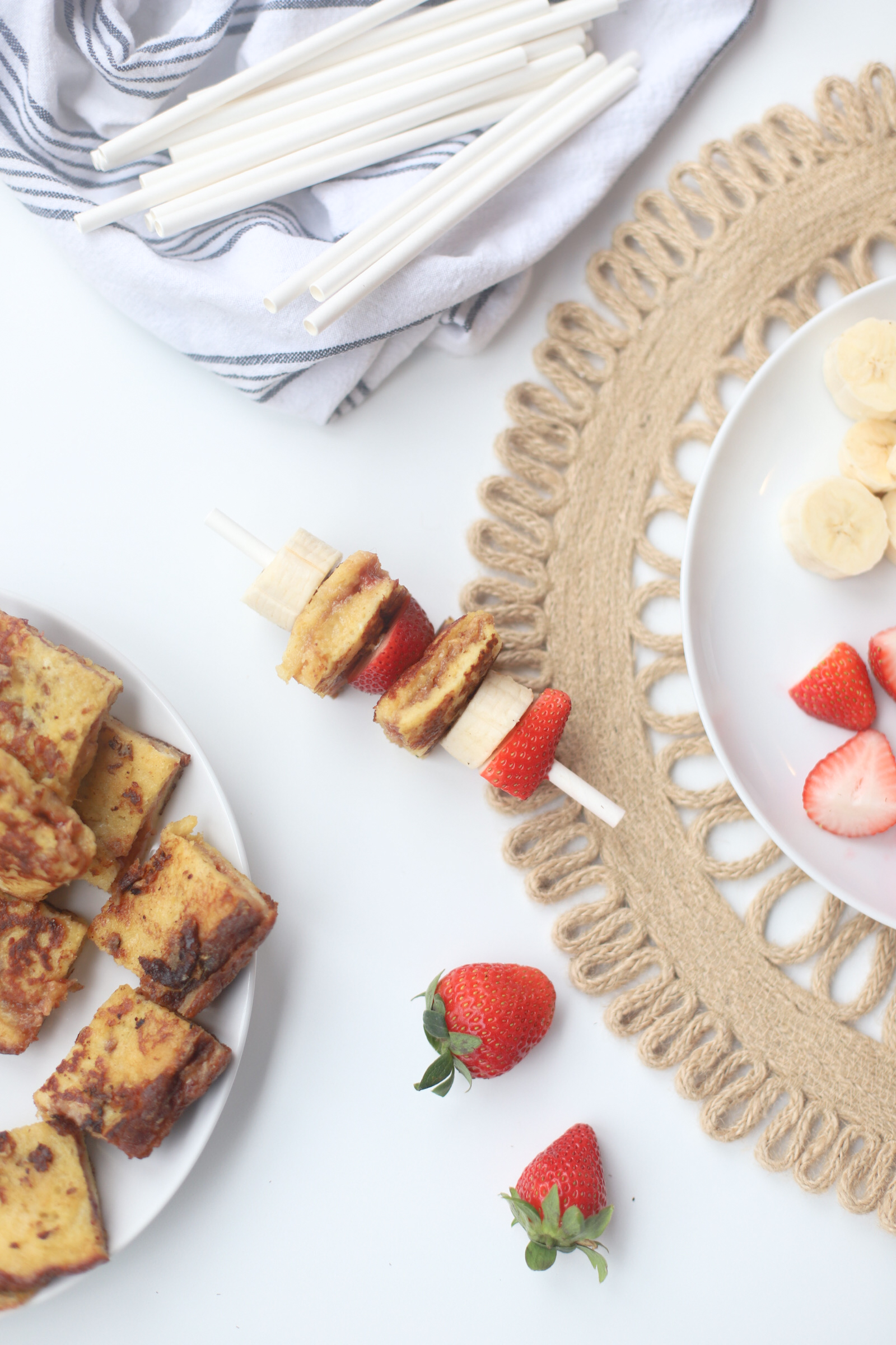 Make these adorable and decadent stuffed PB&J French Toast Kabobs for your next brunch. Peanut butter and jelly crossed with French toast never tasted so good! Click through for the recipe. | glitterinc.com | @glitterinc