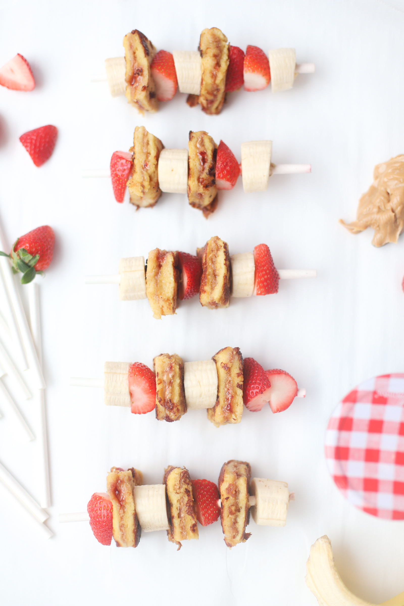 Make these adorable and decadent stuffed PB&J French Toast Kabobs for your next brunch. Peanut butter and jelly crossed with French toast never tasted so good! Click through for the recipe. | glitterinc.com | @glitterinc