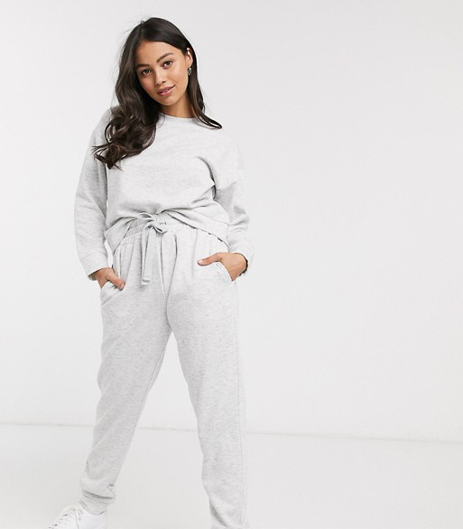 Slip into one of these adorably chic and on trend Loungewear Sets and Matching Sweatsuits, look cute as could be from the comfort of your sofa, and and stay on budget. These adorable and under $50 cozy and chic sets will get you through the season in total comfort! | glitterinc.com | @glitterinc // ASOS DESIGN Petite lounge sweat & jogger set