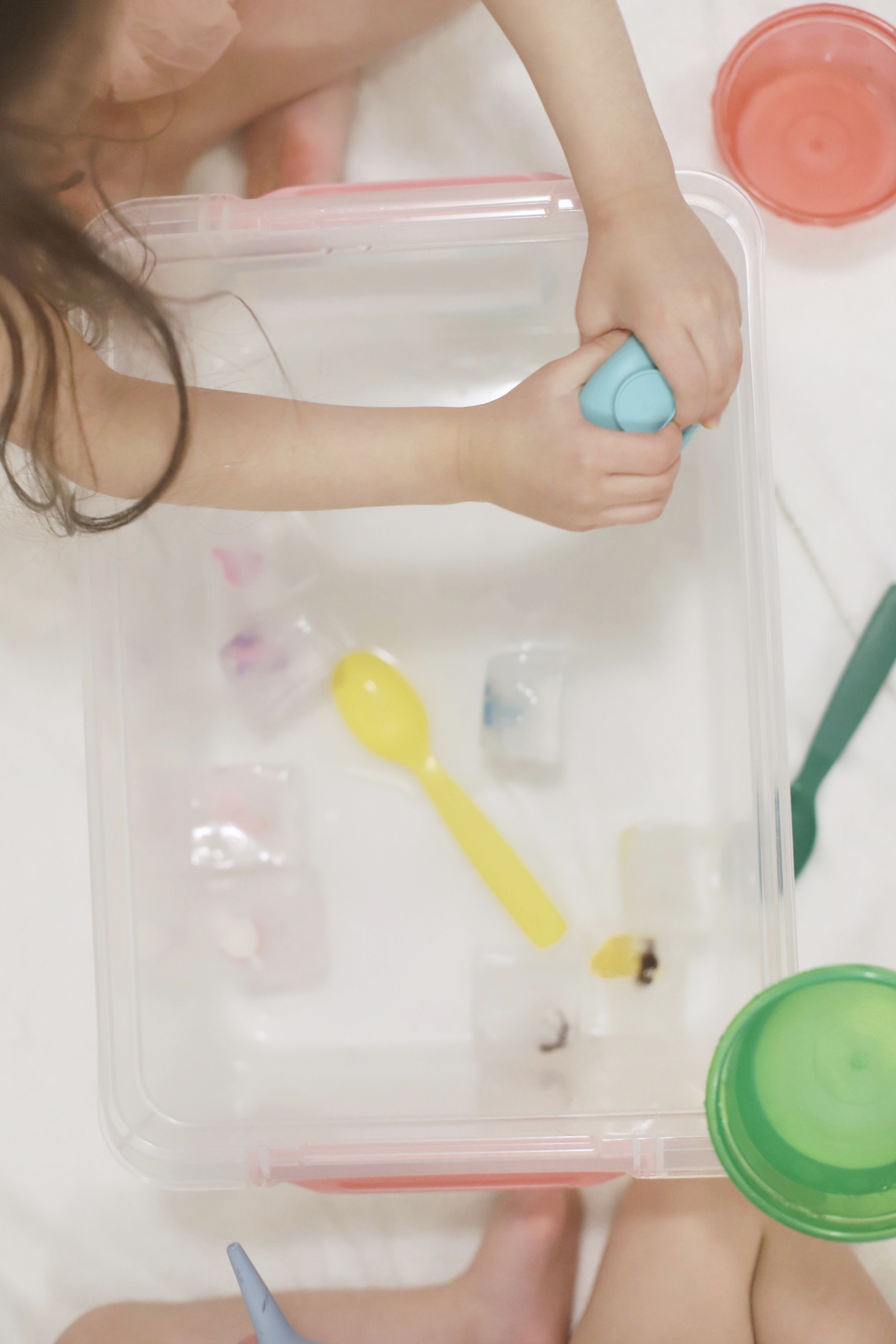 Home with your young kids? Here is a huge list of fun and educational activities to do at home with young kids, including exactly how to entertain your children during school closures, cold and flu days, Spring and Summer vacation breaks, and more. | glitterinc.com | @glitterinc // Ice Excavation Kids Activity