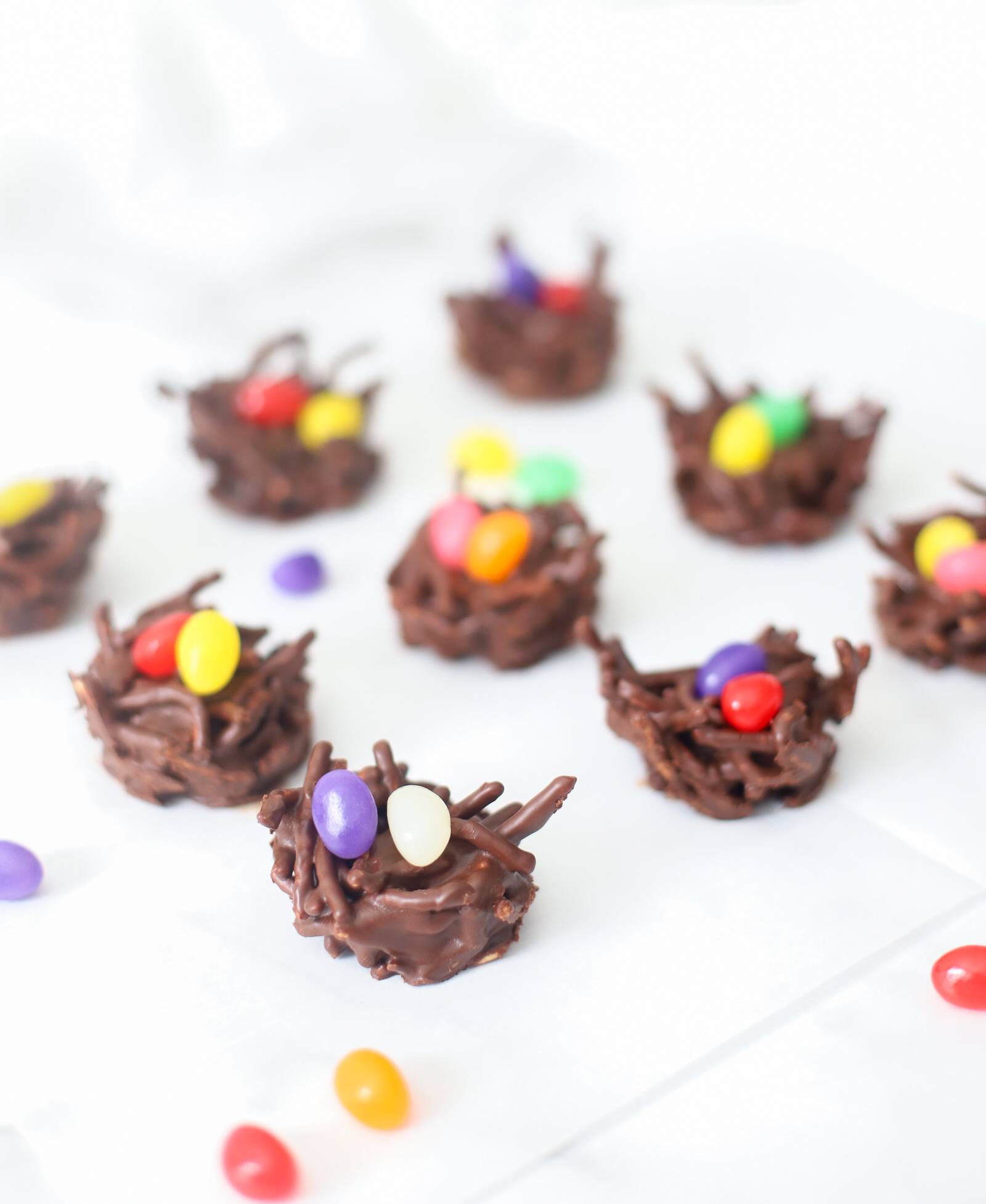 Celebrate Easter and the spring season with these adorable no-bake chocolate birds nests. The recipe is super simple to make, totally kid-friendly, and with a few easy tweaks, your chocolate bird's nest can be made totally vegan! | glitterinc.com | @glitterinc