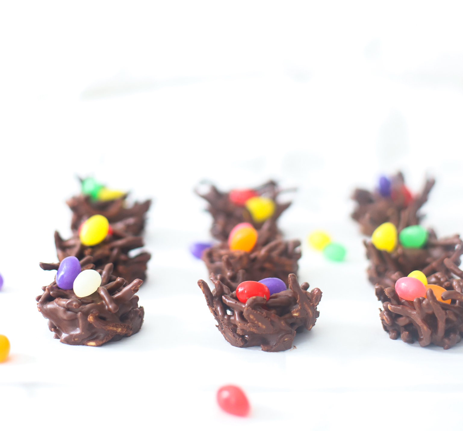 Celebrate Easter and the spring season with these adorable no-bake chocolate birds nests. The recipe is super simple to make, totally kid-friendly, and with a few easy tweaks, your chocolate bird's nest can be made totally vegan! | glitterinc.com | @glitterinc