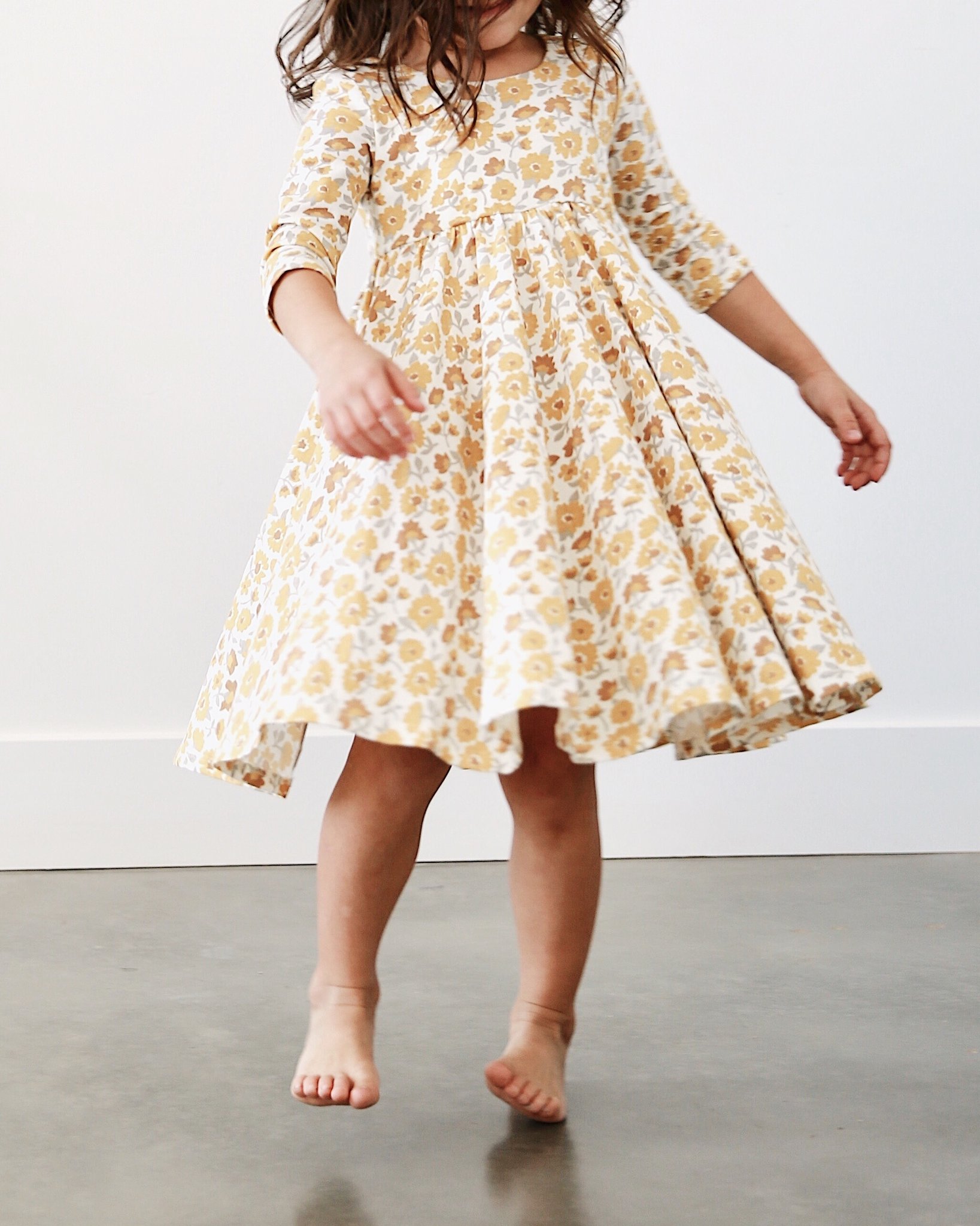 If you have a little girl who loves a great twirly dress, this post is for you! Sharing where to find the very best twirly dresses; a.k.a., skater dresses, for kids. | glitterinc.com | @glitterinc // Remie Girl Twirly Dress