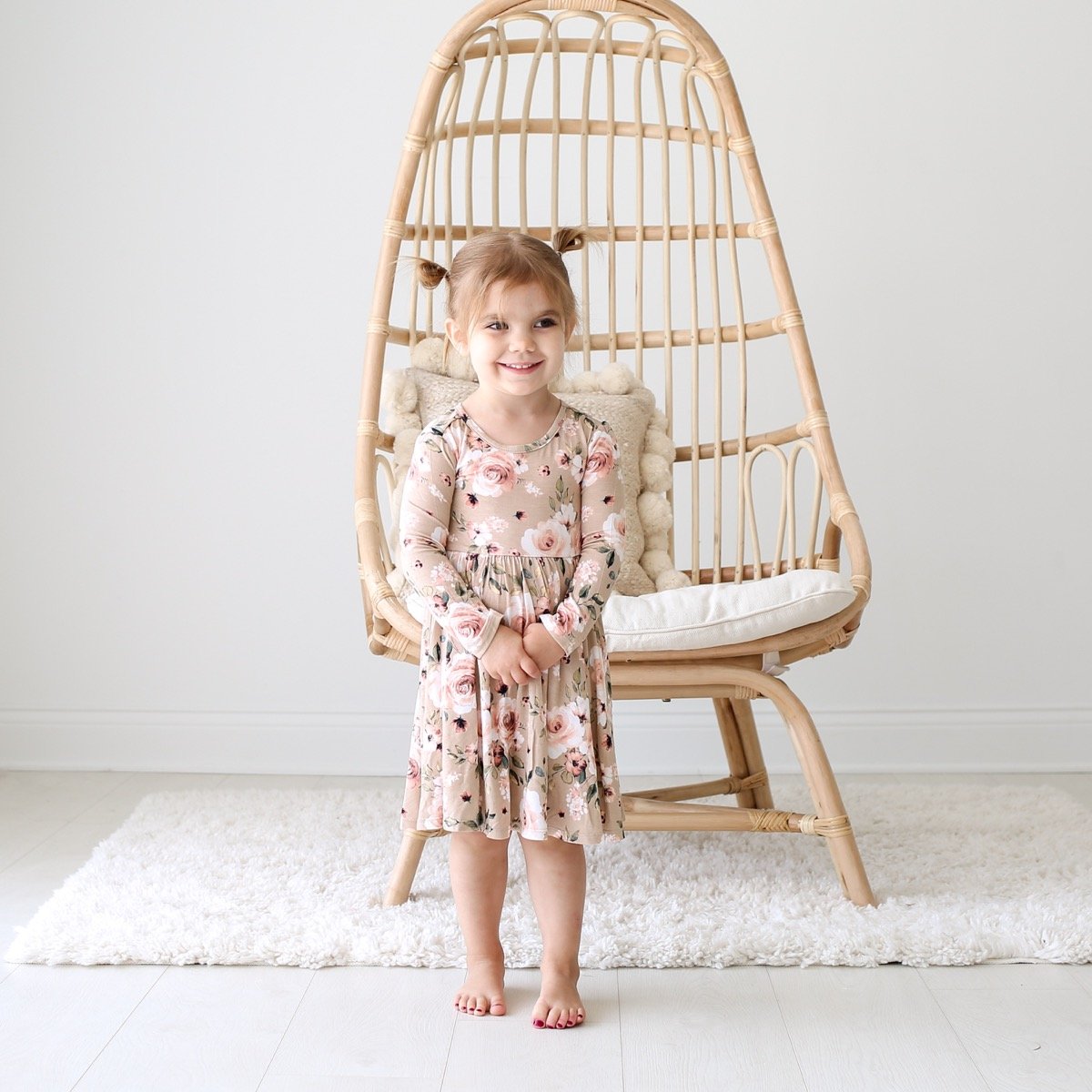 If you have a little girl who loves a great twirly dress, this post is for you! Sharing where to find the very best twirly dresses; a.k.a., skater dresses, for kids. | glitterinc.com | @glitterinc // Posh Peanut Sienna Floral Long Sleeve Twirl Dress