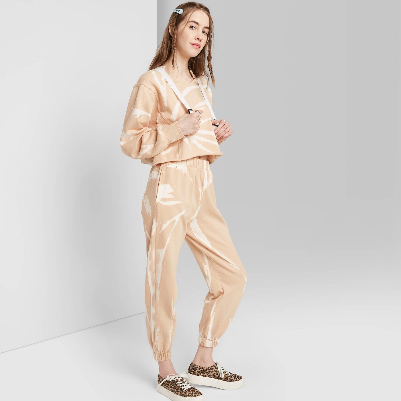 Slip into one of these adorably chic and on trend Loungewear Sets and Matching Sweatsuits, look cute as could be from the comfort of your sofa, and and stay on budget. These adorable and under $50 cozy and chic sets will get you through the season in total comfort! | glitterinc.com | @glitterinc // Wild Fable Women's High-Rise Tie-Dye Sweatpants and Crop Sweatshirt