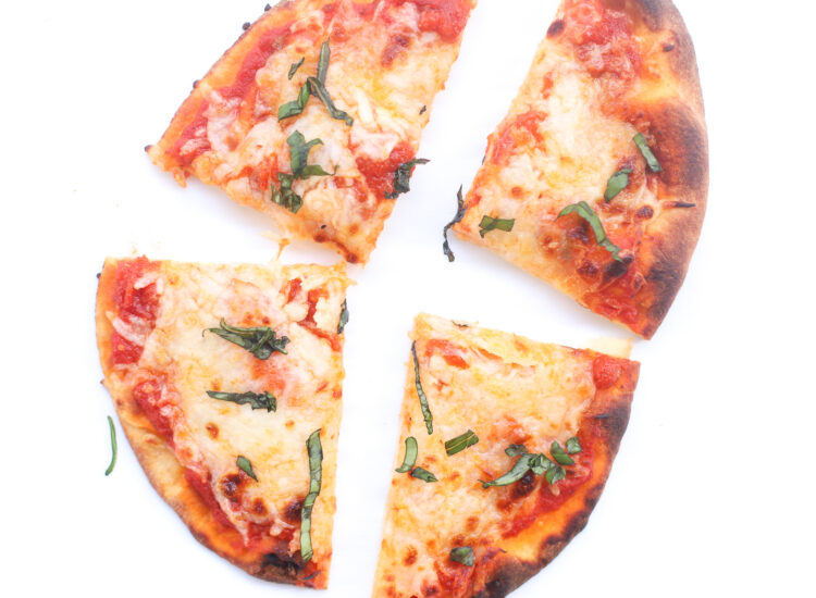 Our Favorite 10-Minute Naan Bread Pizza recipe bakes up with a crispy, golden crust, is topped with tomato sauce and bubbly cheese, and is so easy to make. The whole family loves making and eating these delicious simple at-home pizzas for lunch and dinner! | glitterinc.com | @glitterinc