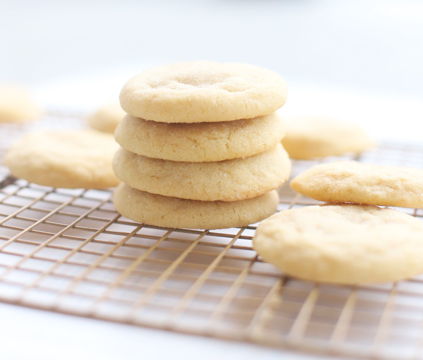 The best and most unbelievably perfect dairy free sugar cookies, rolled in crisp sugar on the outside, soft, thick, and chewy on the inside; these pillowy sugar cookies will quickly become your new favorite sugar cookie recipe! | @glitterinclexi | GLITTERINC.COM