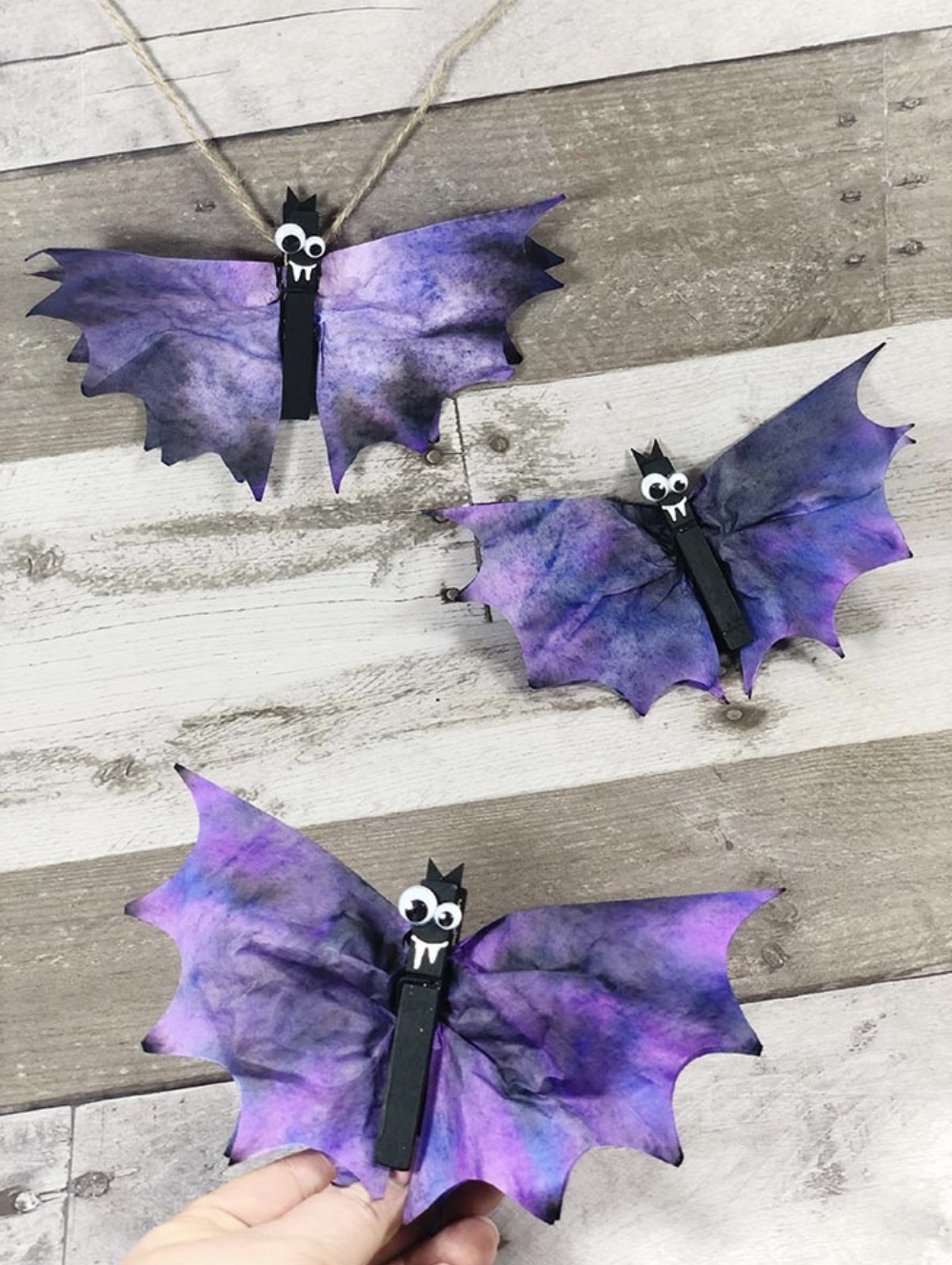 Get crafty this October and create something special with one of these 7 easy Halloween crafts and hands-on activities for toddlers and young kids! | @glitterinclexi | GLITTERINC.COM // Coffee Filter Bats Halloween Craft for Kids