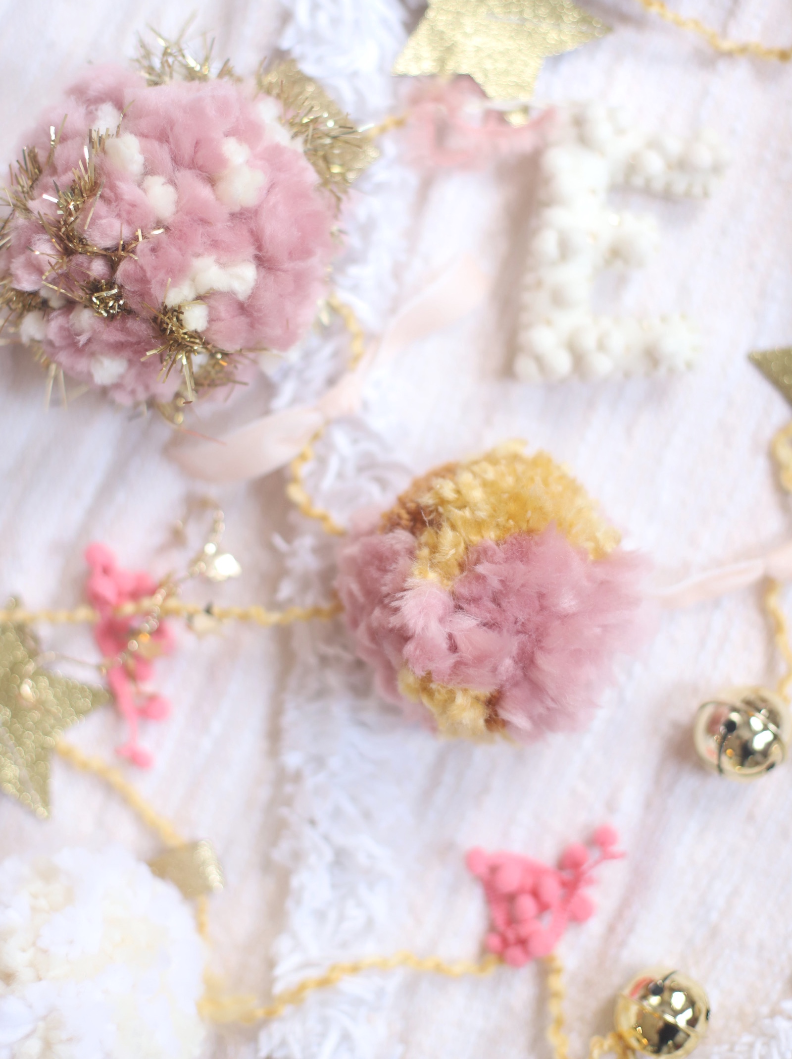 Make your own boutique-worthy DIY festive tinsel, ribbon, and glitter stars pom pom garland; a.k.a., a glammed up pom pom garland with a whole lot of pizazz.| @glitterinclexi | GLITTERINC.COM