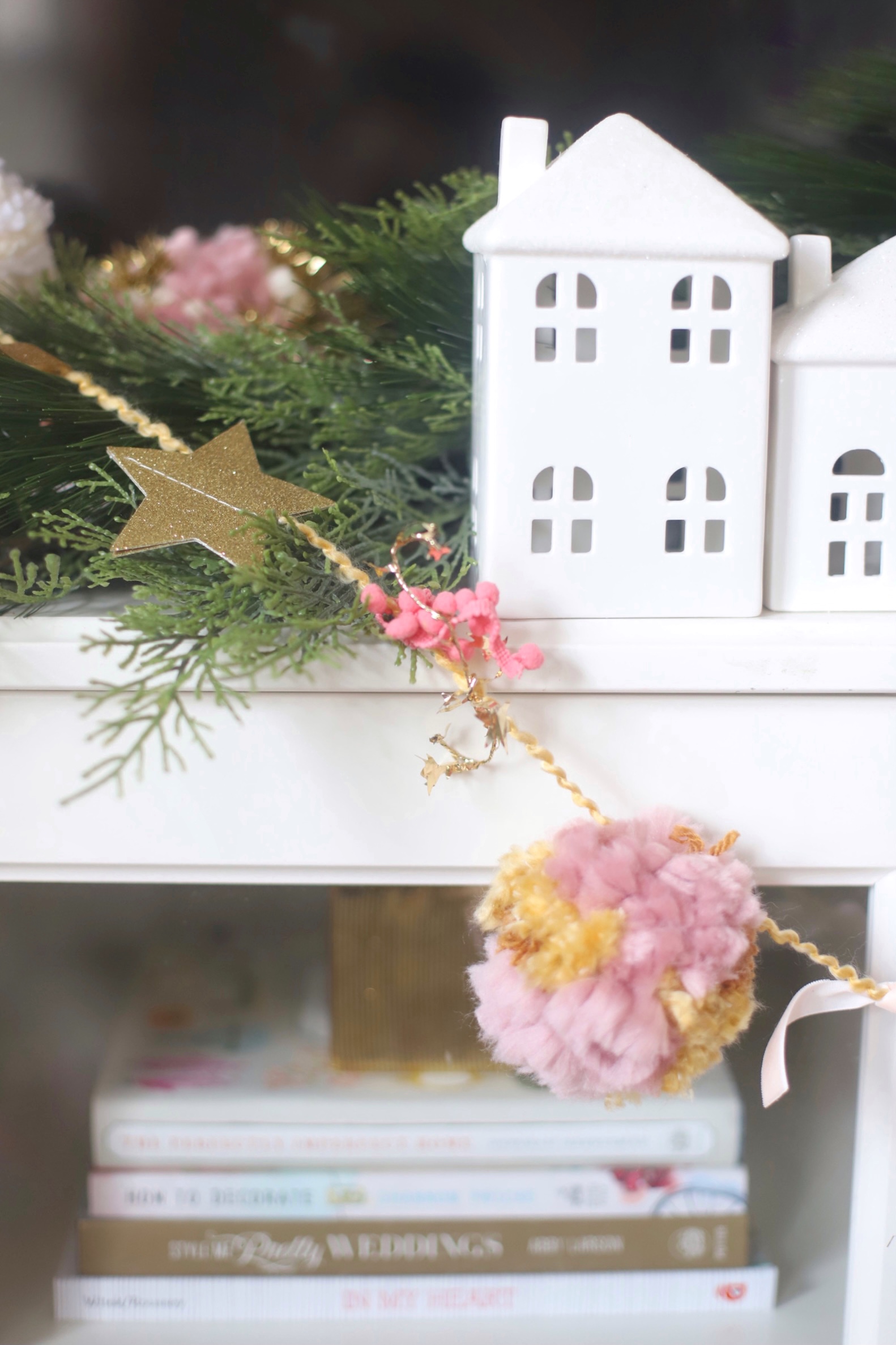 Make your own boutique-worthy DIY festive tinsel, ribbon, and glitter stars pom pom garland; a.k.a., a glammed up pom pom garland with a whole lot of pizazz.| @glitterinclexi | GLITTERINC.COM